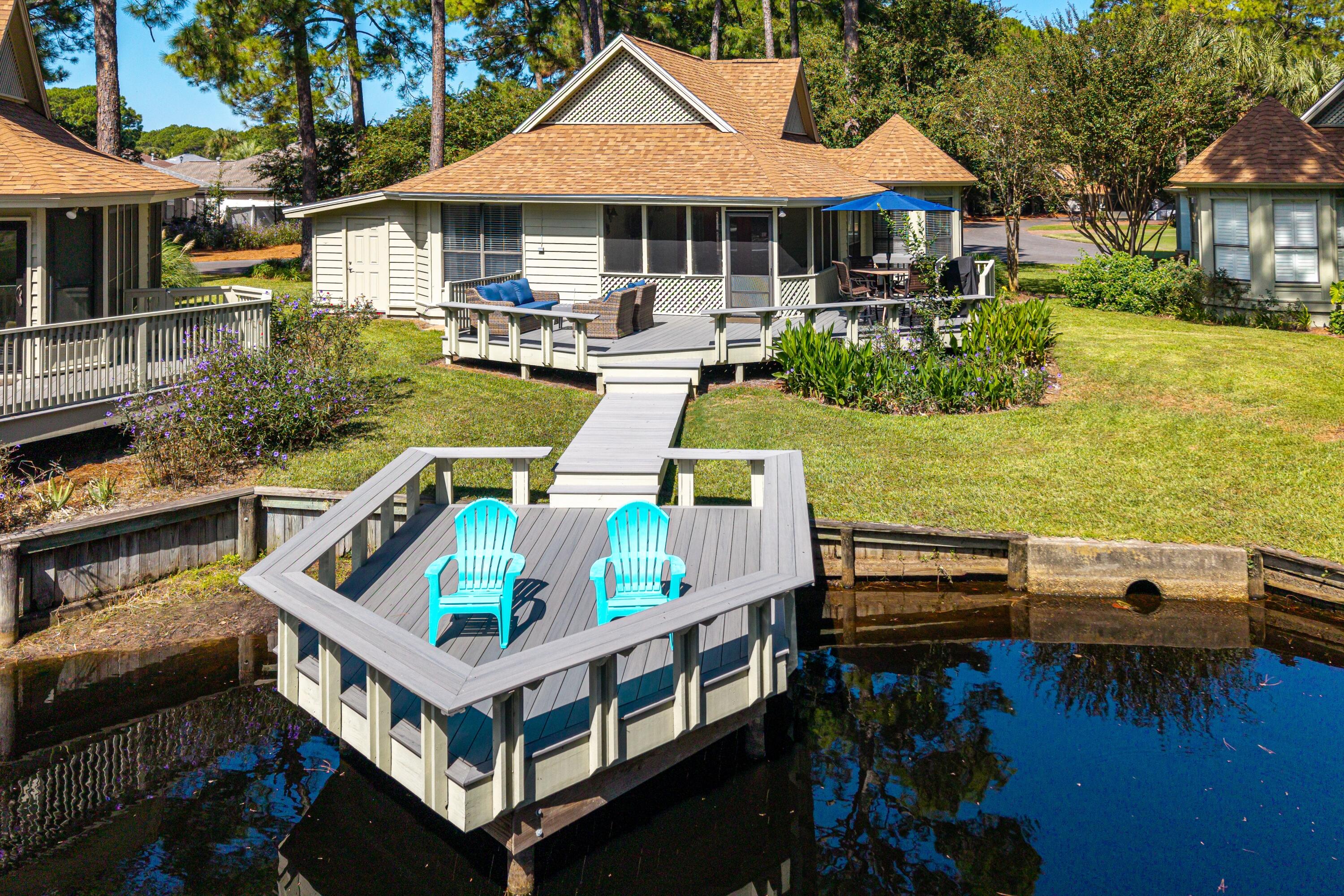 Nestled on the pond in the sought-after Fairways community of Sandestin Golf & Beach Resort, this charming coastal cottage comes fully furnished and offers the perfect blend of comfort, convenience, and modern upgrades.
Surrounded by lush landscaping, the outdoor living shines with an oversized TimberTech front porch, expansive back deck, and upgraded dock complete with solar café lights--ideal for sun-filled days and relaxed evenings by the pond.
Inside, the home is beautifully furnished and move-in ready, featuring an updated kitchen with French door refrigerator (2024) and 5-burner convection/air-fryer range(2024), plus a luxurious Sleep Number split king adjustable bed. Smart features throughout include keyless entry, upgraded bathroom fans with Bluetooth and night lights, and multiple wall-mounted TVs bringing convenience and style.

This home also features a brand-new roof (2025), new water heater and breaker box (2024), full-size Samsung washer/dryer, oversized parking pad for cars and golf carts, and a custom shed. The cozy screened porch with café lights is the perfect retreat after a long day at the beach.

Sold fully furnished, this Fairways gem offers effortless living and access to the world-class resort lifestyle that Sandestin Golf and Beach Resort is known for.

As an introduction to the Sandestin lifestyle, we invite our new owners to explore amenities that make Sandestin special. The listing brokerage and seller(s) are presenting the buyer(s) of this property with (2) 90-minute rounds of Tennis court time, a golf foursome at one of our three championship courses, and a round of golf for up to four (4) players at the unrivaled Burnt Pine Golf Club.

Sandestin Golf and Beach Resort features more than seven miles of beaches and pristine bay front, four championship golf courses, 15 world-class tennis courts, a 226-slip marina, a fitness center, spa and celebrity chef dining. Shop, dine and play at the charming pedestrian village, The Village of Baytowne Wharf and more. Inside the gates of the resort, residents enjoy a balanced lifestyle of high-class living, spanning the 2,400 acres from the beach to the bay. Everything within the gates of the resort is accessible by golf cart or bicycle. The entire resort is interconnected by miles of pedestrian, bike and golf cart paths that weave through groves of live oaks, meandering past natural lagoons, fountains, man-made lakes, and meticulously landscaped fairways.