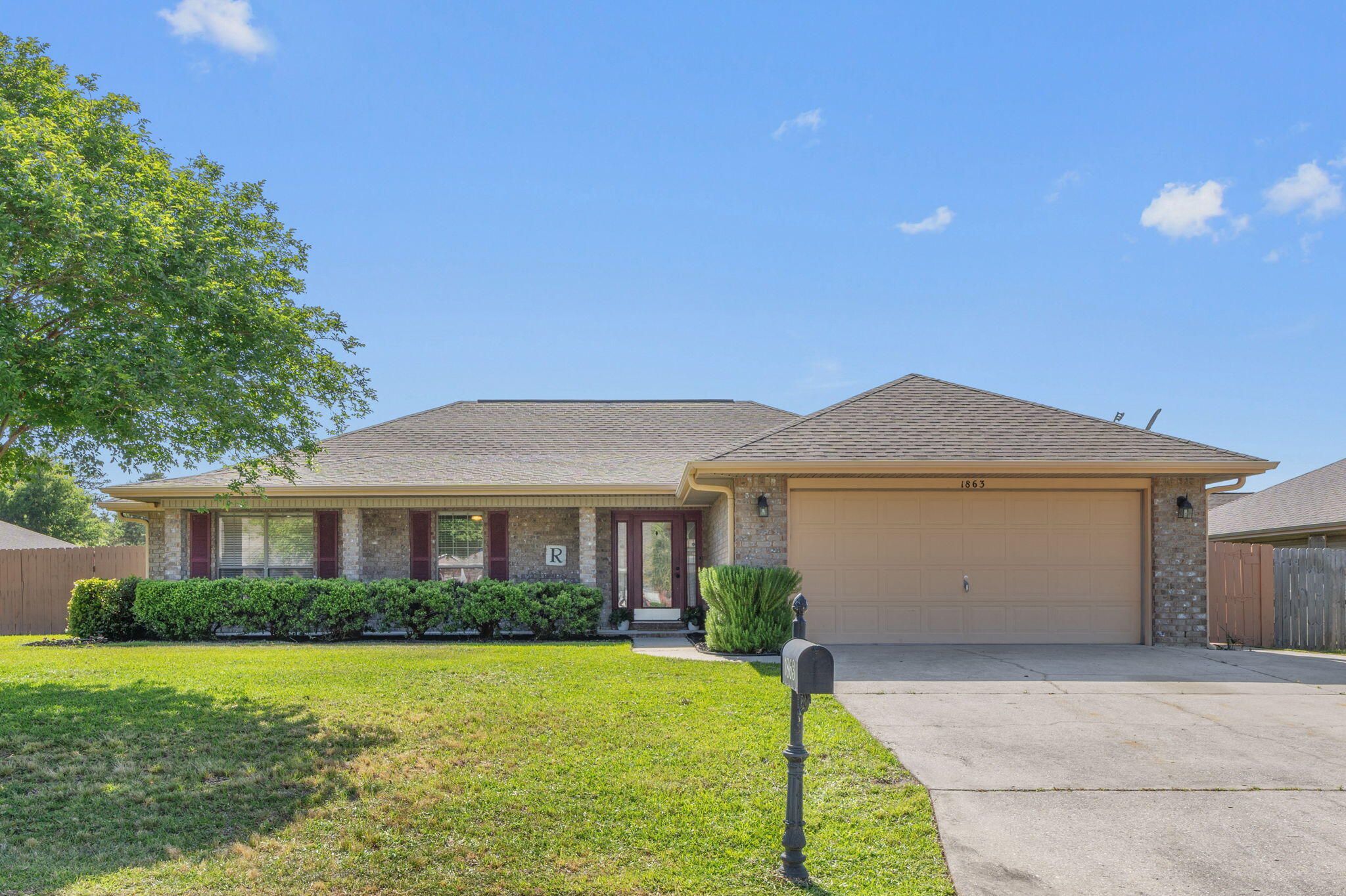Welcome to your Bay Side retreat in the heart of Santa Rosa County! This 4 bed 2 bath home sits on a corner lot in a tucked away community. As you step inside, you're greeted by a bright living area with smooth vaulted ceilings overhead. New luxury vinyl plank flooring flows throughout, complemented by fresh paint, recessed lighting, and updated lighting fixtures in each room. The kitchen offers generous granite countertop space and an open layout. Four spacious bedrooms provide plenty of room for family, guests, or a home office. Outside, a widened driveway allows for additional parking.  The sizable yard features a sprinkler system for for easy lawn maintenance, and an 8x16 workshop/shed-complete with power. This home is walking distance to the Bay and it's wonderful paved walking path.