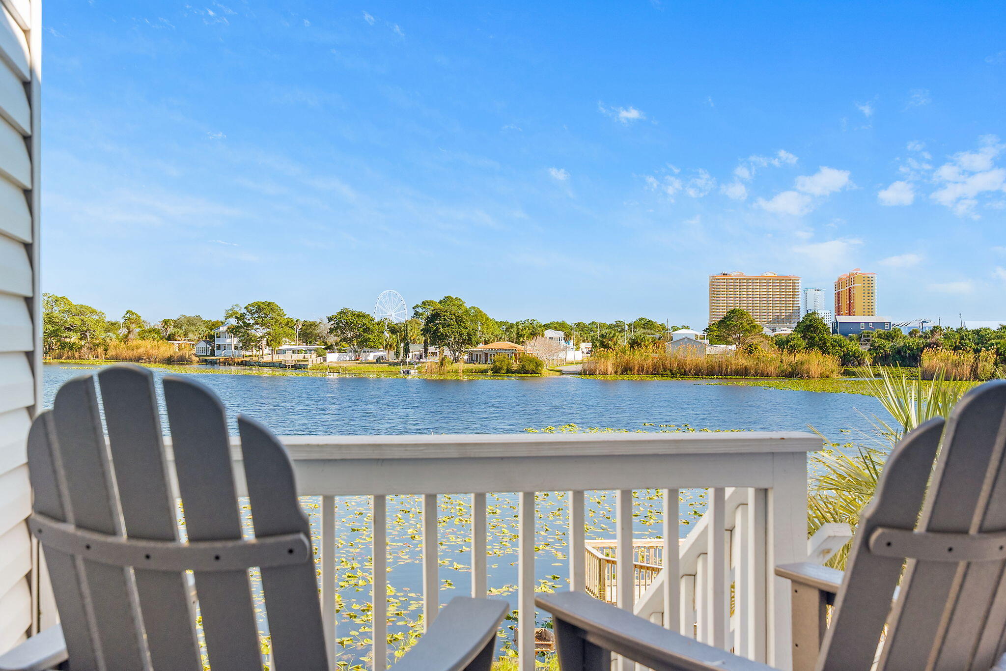 Discover the hidden gem of Lullwater Unit 417. Nestled on Lullwater Lake, you can literally see Pier Park from the balcony.  Inside this 2-bedroom, 2-bath condo you will find updated bathrooms and an updated kitchen with newer cabinets and appliances, making this unit both stylish and functional. Lullwater Condominiums has undergone extensive exterior improvements, including an impact-resistant front door and windows, new roof, new siding, and new steps and deck, giving the community a fresh, modern look.  Major systems have also been updated including a new AC installed in 2023 and a new washer/dryer in 2024, providing peace of mind for owners and investors alike.  Ideally located just across Front Beach Road from the beach, ½ mile from Pier Park, 1 mile from Frank Brown Park, and minutes from Dolly Parton's Pirate Voyage and Topgolf, this condo truly has it allwhether you're looking for a vacation retreat, investment property, or full-time residence.