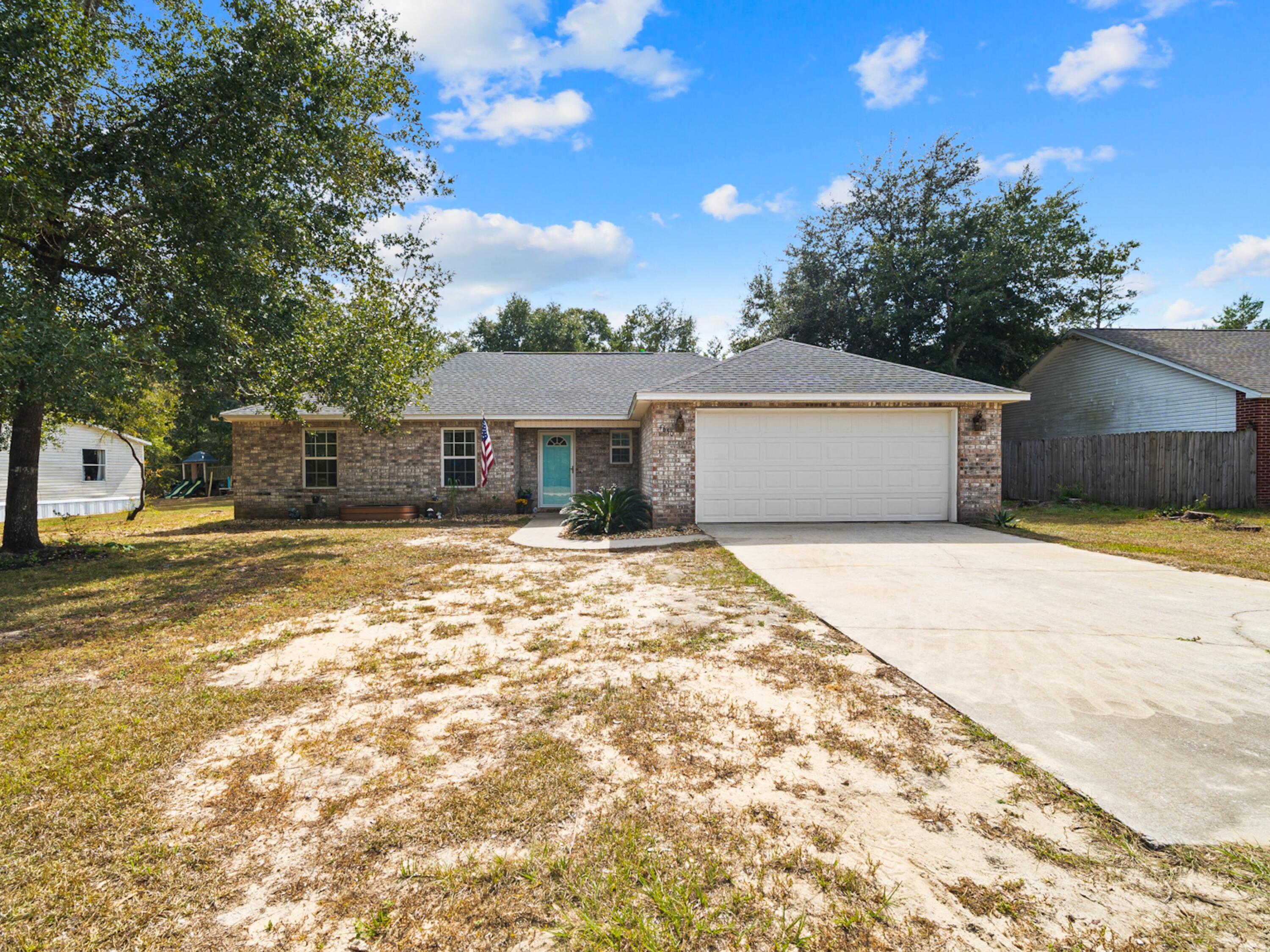 Beat Inflation and stabilize rising cost with the added features of this spacious single-story home in The Pines occupies a large open lot. The brick front makes a good first impression, along with eco-friendly solar panels on the roof. Spacious rooms and an open floor plan provide versatile living space with updated  flooring throughout. Both bathrooms have also been revamped with vanities, countertops and mirrors for a pristine finish. A wide entrance foyer opens into the massive dining and living area with ample space for entertaining. Perch on stools around the wood-topped breakfast bar and engage in chatter with the designated chef. The kitchen is well-appointed with a pantry and a full range of cabinets. Updates by the current owner include new stainless steel appliances, countertops and tile backsplash. There's a dining area for family mealtimes. Four spacious bedrooms have pleasant views of the yard and the master includes a large-walk-in closet. Step out through sliding glass doors to the covered portico ideal for hosting weekend barbecues. There's ample space for kids and pets to romp and play beneath mature trees in the fenced yard. This single-family home is well located for anyone looking for an easy commute to Air Force bases via Highways 85 or 285.