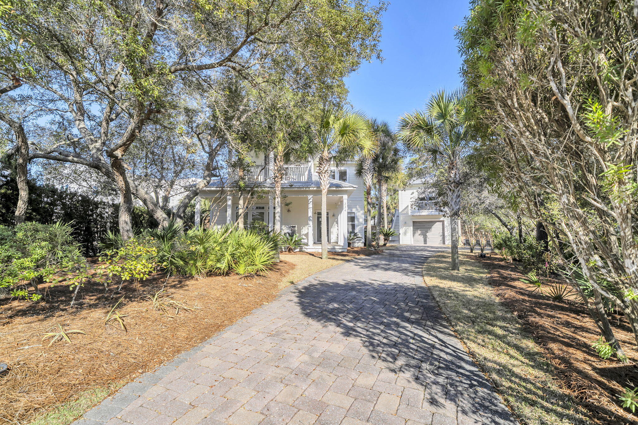 Welcome to 334 Seabreeze, a refined coastal sanctuary where elevated design meets effortless luxury living. Perfectly positioned to capture ocean breezes and natural light, this exceptional residence blends timeless architecture with modern sophistication, and the beach is just at the end of the street for effortless access to sun, sand, and surf. The main home offers 4 bedrooms and 3.5 bathrooms, each thoughtfully appointed and beautifully renovated with fresh, beach-inspired tile selections that reflect the home's coastal setting. The luxurious primary suite features a spa-like bath complete with a steam shower, creating a private retreat designed for ultimate relaxation. At the heart of the home is a completely reimagined, full-scale kitchen remodel crafted for everyday living and elevated entertaining alike. Custom cabinetry, designer finishes, expansive granite countertops, and a statement island create a striking focal point, complemented by a full suite of professional-grade Sub-Zero and Wolf appliances including a full size wine refrigerator. A warm and inviting gas fireplace enhances the main living space, adding character and ambiance. Situated on an oversized lot, the property features a fully fenced backyard offering privacy and ample space for outdoor enjoyment, along with a charming screened-in porch perfect for relaxing or entertaining year-round. For those envisioning an elevated outdoor oasis, a complete set of professionally drafted backyard plans is available, thoughtfully designed to incorporate a pool and expanded entertaining areas. Adding to the property's versatility is a charming carriage house featuring 1 bedroom and 1 bathroom, along with a one-car garageideal for guests, extended family, or a private office retreat. This is coastal elegance redefined  a rare opportunity to own a meticulously upgraded residence where craftsmanship, comfort, and an unbeatable location converge, all with the added benefit of no HOA and no fees. Whether you're seeking a stunning primary residence or a high-potential rental investment, 334 Seabreeze offers exceptional flexibility and value in an enviable beachside setting.