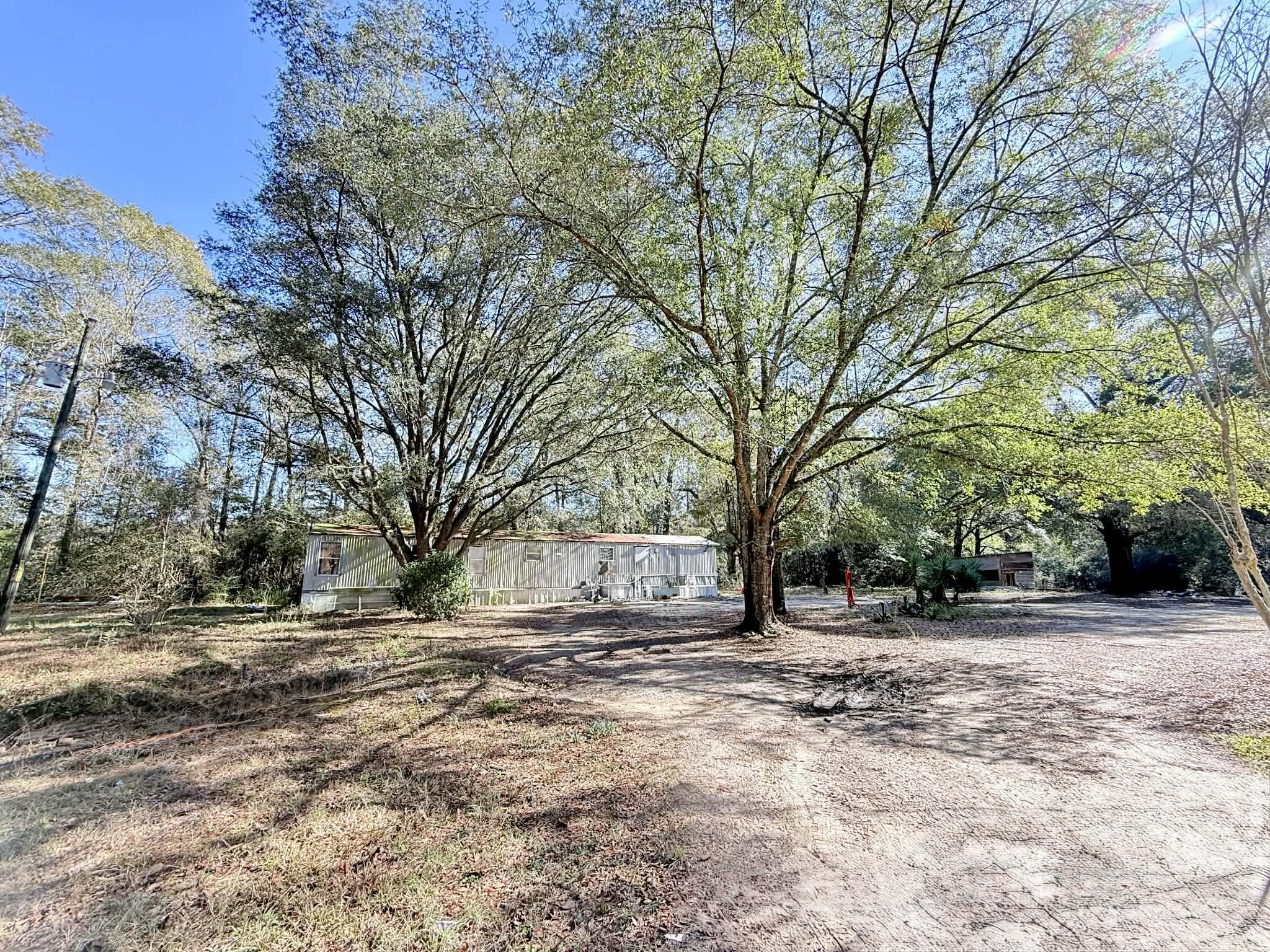 Located just South of Samsom towards the Florida State line sits this 2.76 acres with all the improvements already in place. Property includes a great wooded area, septic tank, power, and well in place and also includes outside buildings. Property allows for chickens, horses etc. and has room to garden. Currently property includes a 3 bedroom / 2 bath 1993 single wide on property given no value but will remain with property. SOLD AS IS WHERE IS Looking for a great place to have a hunting camp near the Geneva County Forest or a place to build your dream home - this property offers tons of opportunities at an affordable price! Appointment only.