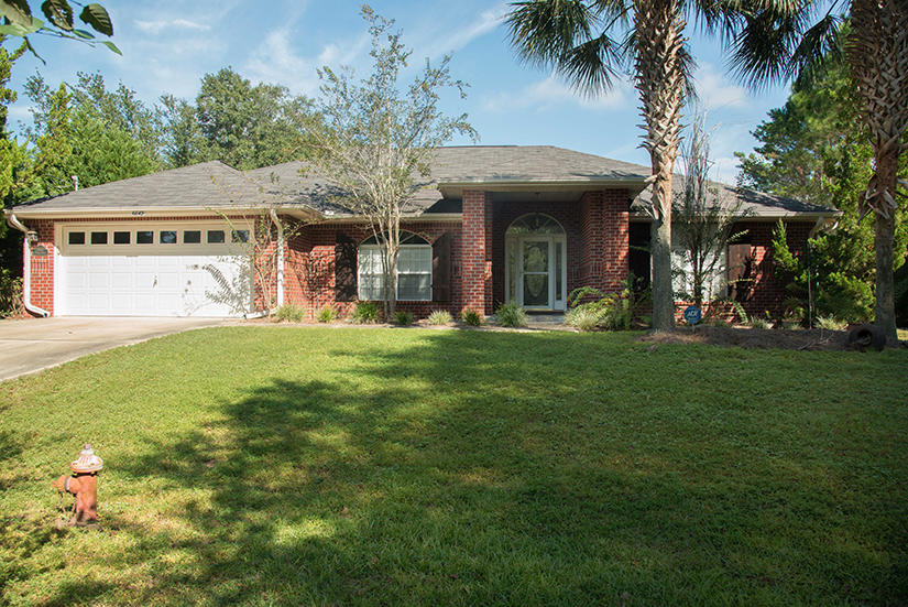 All new paint! You will love this location at the end of a cul-de-sac in Holley By The Sea. Enjoy the amenities from swimming pools to tennis courts, water access, community room, playground and much more. Interior features a breakfast bar and nook, fireplace, plant shelves, formal dining room, split bedroom plan, master suite with two walk-in closets, garden tub and separate shower. Separate detached garage/workshop with it's own driveway. Large screened porch on the back of the home. This is a NO Pets and NO smoking Home. All electric home.