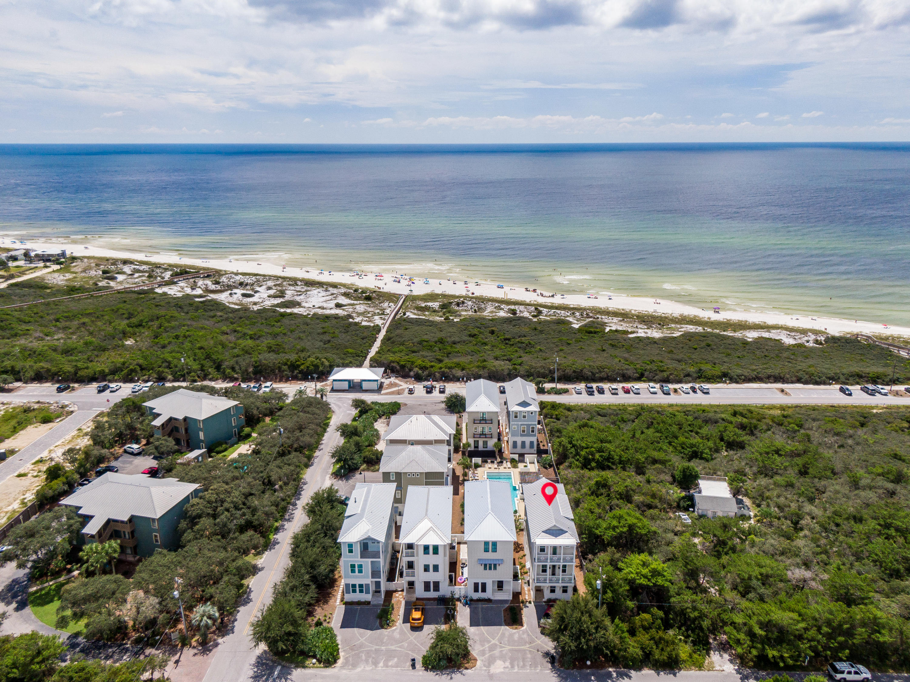 Sol Serenity is a classic Florida beach house with breathtaking Gulf views from the 2nd and 3rd floor. The 1st floor features a large open floor plan with a living room with fireplace and combined kitchen and dining areas. The kitchen features stainless steel appliances with glass tile backsplash and marbled white countertops.There is a spacious guest bedroom off of the kitchen with a king bed and a full bath. On the 2nd floor you will find the master bedroom with a private balcony overlooking the community pool with Gulf views. The master bath features dual vanities, a soaking tub and separate shower. Down the hall is another guest bedroom with en suite bathroom. On the 3rd floor you will find a bunk room with 4 twin beds and private bathroom. Just past the bunkroom there is a second living room with french doors that open to a balcony complete with built-in grilling station and outdoor dining room. You will not want to miss the stunning views of the Gulf of Mexico from this balcony! Buyer to verify all information.
