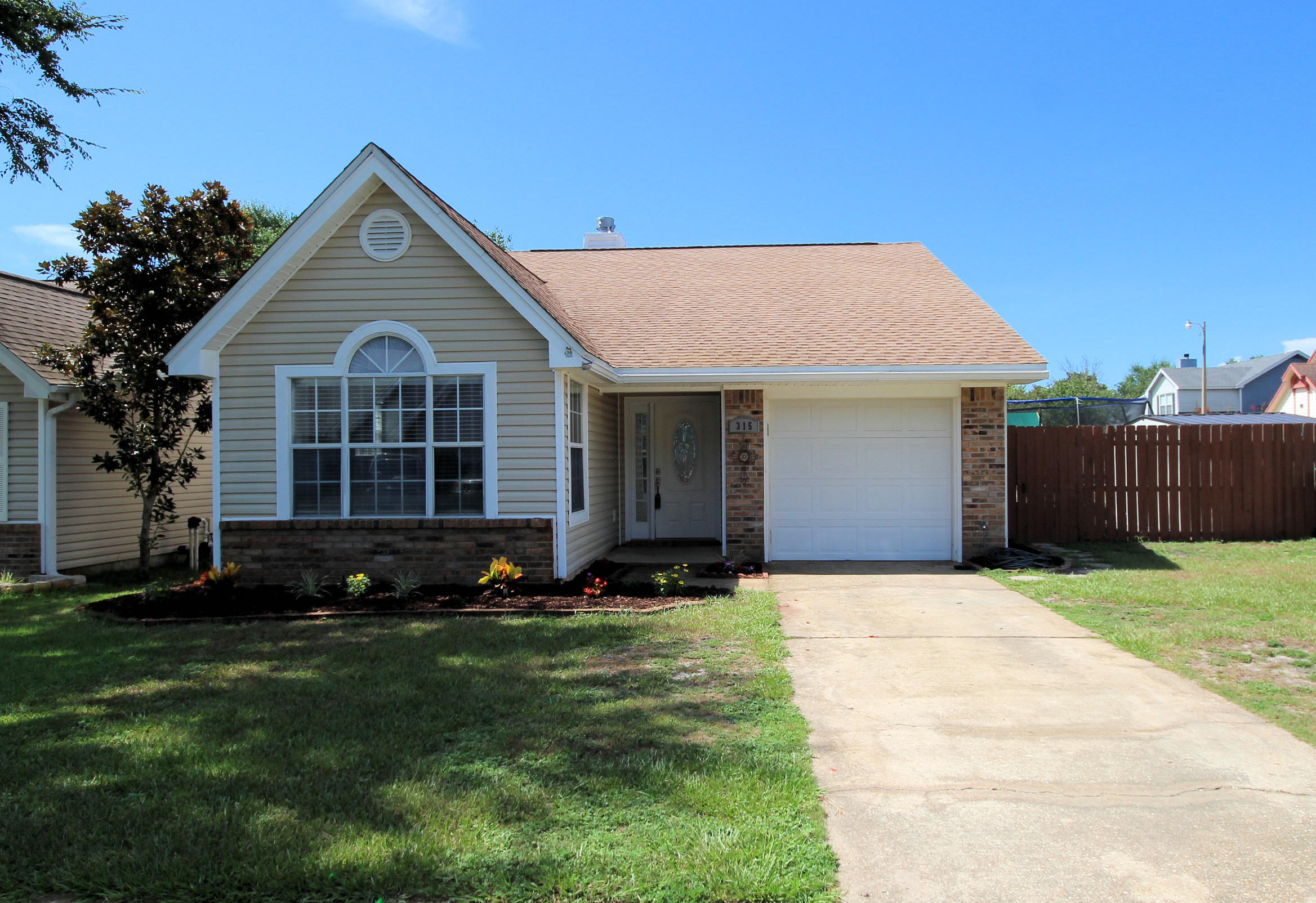 Renovated home from top to bottom! Granite counters in the Eat-In kitchen, contemporary cabinets, white appliances, and ceramic tile flooring and newer carpet. Fresh paint throughout and plenty of natural light. Updated white trim and wide baseboards give this home a modern look. Corner lot with privacy fence. Enter tile flooring foyer which leads to living room with 12 foot ceilings, a wood burning fireplace, and a sliding door to a wooden deck. Bathrooms have updated vanities and tile flooring. Abundant natural light from a skylight in hall bath. Convenient to Hurlburt Airfield, this three bedroom two bath home is a must see! Buyer to verify all information and square footage deemed important to them.