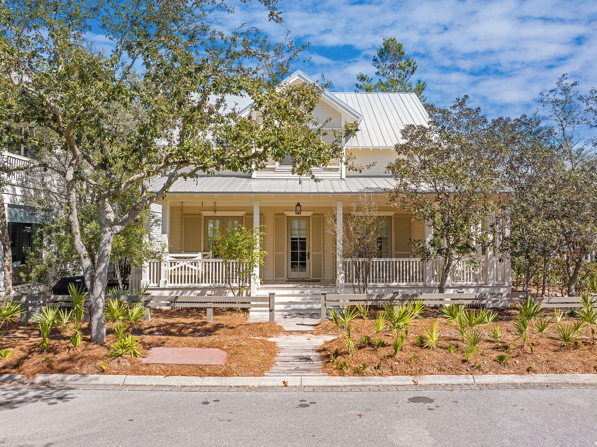 Located in the sought-after Lake District of WaterColor, this recently remodeled 5-bedroom, 4.5-bath home blends modern updates with effortless coastal charm. Situated on a spacious corner lot, it's just a short stroll to the Frog Pool, Sand Hill Circle park, Camp WaterColor, and the scenic footbridge leading to the Town Center. With a newly painted exterior and a brand-new private pool and spa, this home is designed for seamless indoor-outdoor living.

Inside, the open layout is bright and inviting, with fresh finishes and a coastal feel throughout. The spacious living area is warmed by wood floors and natural light, while the chef-inspired kitchen is equipped with high-end appliances, a large center island, and custom cabinetry, making it perfect for hosting friends and family. The first-floor primary suite highlights coastal living with shiplap accents and barn doors leading to the closet. Upstairs, you'll find four additional bedrooms, including a built-in bunk room, all thoughtfully designed for comfort and convenience.

Above the garage, the carriage house creates additional living space with a bedroom and bathroom, perfect for guests. A covered walkway connects the carriage house to the main house, providing privacy and ease of access.

Step outside to enjoy the oversized screened porch, perfect for morning coffee or outdoor dining, or relax on the expansive wraparound porch and take in the laid-back atmosphere of WaterColor. The brand-new private pool and spa are a great addition, creating a serene space to unwind after a day of biking, beaching, or exploring 30A.

With access to WaterColor's world-class amenitiesincluding the Beach Club, multiple resort-style pools, nature trails, and the lazy river at Camp WaterColorthis home is a rare opportunity to embrace the best of the 30A lifestyle, where every day feels like a vacation.