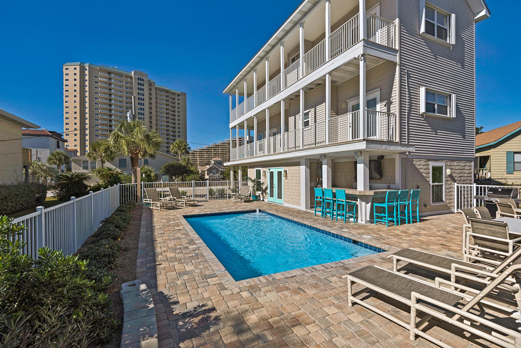Extreme Home Makeover Just Steps from the Gulf of Mexico! Rental income grossed $135K for 2017. No HOA fees and low costs of ownership make this a rental winner. The total renovation includes a new pool, a fully equipped pool bar, remodeled kitchen, renovated baths, a first-floor expansion, two added bedrooms/baths, a second living room and much more. This fresh and current coastal getaway is tucked away on a meandering, sandy road in a peaceful, private enclave of Old Florida enchantment that hints of Original Destin. The gated pool area features a sizable, heated pool with automatic pool fill, paver decking, alfresco dining area with seating for 21, Weber natural gas grill, gated beach access, and a pool bar with ice maker, sink, TV, Sonos Bluetooth stereo, beverage center, and seating. This home exudes originality and presentation in coastal design. Nautical themes, neutral palettes with pops of color, natural woods, and white surfaces soothe the senses and compliment vistas of sky blue and emerald green. Two levels of wrap-around corner balconies highlight scenic gulf views. A beach walkway open through the pool area offers immediate access to a pristine, quiet beach. The main living/dining/kitchen area on the second floor is open, airy, and seats a crowd. The remodeled, U-shaped kitchen features new stainless steel appliances, granite counters, and a breakfast bar. An additional living room conveniently located on the first floor is a relaxing gathering spot after a day at the beach or pool. This home features three master suites. The two, third-floor master suites offer Gulf views, large walk-in closets, en suites, and balcony access. The first-floor master suite features ample closet space and a private en suite. Bunk rooms are located on the first and second floors. Additionally, the total renovation includes a new paver driveway accommodating 6 cars, repainted decks, replacement of most windows, new lighting, an outdoor shower, updated baths, new electronics throughout, new irrigation and pump, 2 new hot water heaters, new A/C unit on first floor, landscaping redesign, and more. Located along Scenic 98 with close proximity to shopping, dining, and water activities, Norwood Drive is a desirable location for vacation renters and year-round dwellers. Home is a short term vacation rental and could be subject to current & future reservations made on or before closing date.