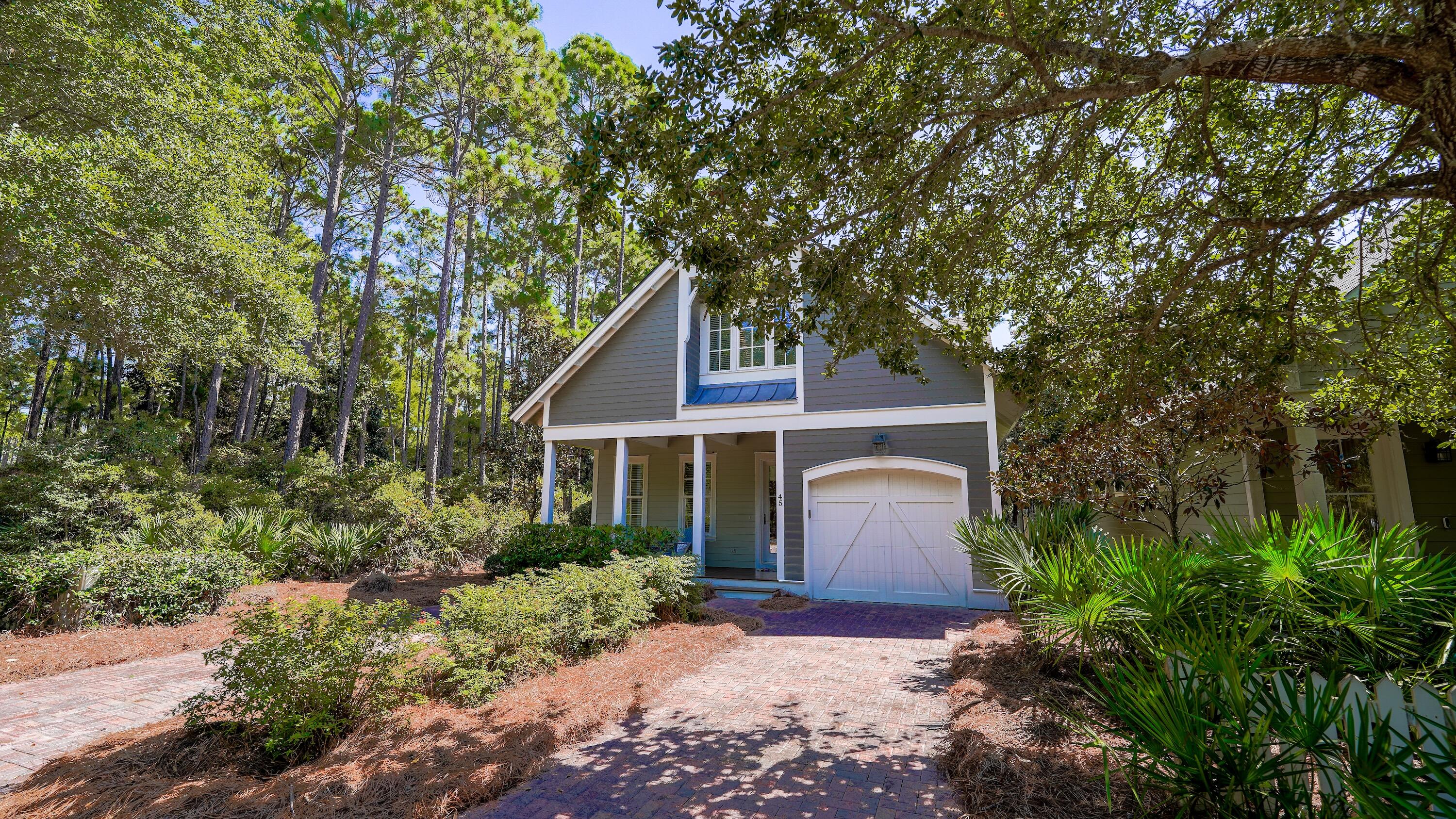 Nestled in the coveted gated community of Watersound West Beach, this stunning home sits on a desirable corner lot adjacent to a peaceful wooded area, offering added privacy and serene natural surroundings. Impeccably maintained and never rented, this home is the perfect retreat for both a beachside getaway or a primary residence. From the moment you step inside, you'll be captivated by the warmth of rich Walnut hardwood flooring and the inviting open-concept design. The living room, dining area, and kitchen are bathed in great natural light, creating a bright and welcoming atmosphere. The thoughtfully designed first-floor primary suite offers convenience and comfort, while the beautifully appointed kitchen features custom cabinetry, Wolf and SubZero appliances, and elegant... Cont... finishes that elevate the space. A dry bar adds to the home's functionality, complete with a SubZero under-counter refrigerator and a new Scotsman ice maker.

Upstairs, the home continues to impress with abundant natural light streaming into the versatile loft area, making it an ideal space for a home office or secondary living area. Two well-appointed guest bedrooms and bathrooms complete the second floor, offering comfort and privacy for family and guests. Every detail of this home has been carefully curated to create a truly one-of-a-kind living experience.

Step outside to the expansive rear screened porch, which stretches the width of the home and offers a serene view of the quiet boardwalk, perfect for relaxing and embracing the coastal breeze.

Watersound West Beach is a sought-after boutique community spanning 66 acres with only 199 homesites. With deeded beach access, a welcoming mix of full-time and part-time residents, and no short-term rental restrictions, this neighborhood provides an unparalleled coastal lifestyle.

Don't miss the opportunity to own this exceptional home in one of 30A's most desirable communities!