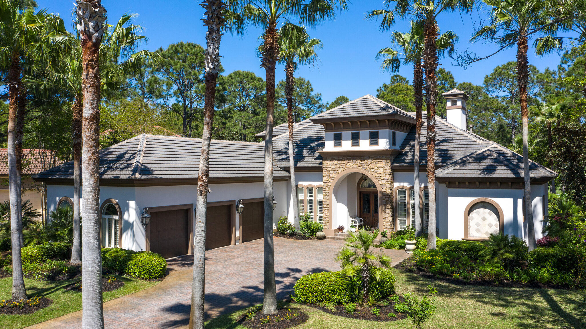 Pristine Ravenwood home located in the Exclusive Burnt Pine neighborhood at Sandestin Golf & Beach Resort. Constructed by Premier builder Boswell Homes with so much attention paid to every detail throughout. The Gourmet Kitchen includes stainless steel chef-grade appliances, refrigerated wine cellar, and large island perfect for any gathering. The primary suite is located on the main level, with private sitting area, ensuite bath, spacious dressing area with large walk in closets. Step  out into the enclosed Lanai and enjoy the pool or spa, and take in the serene views of the Raven Golf Course. Work is always a pleasure from the beautifully appointed study complete with hardwood flooring and shelving. Upstairs you will find a large Guest Suite and a Bonus room- currently a game room, both with access to the spacious screened in balcony. Fabulous home lends itself to entertaining, with soaring ceilings, and open living areas that flow effortlessly into each other. A wall of glass doors easily slide open bringing the outdoors in. The enclosed lanai is complete with gas-burning fireplace, Pool, Spa, and built-in Summer kitchen. Downstairs there are two additional Guest Suites with Bathrooms. Huge Laundry room with storage and 3 Car Garage.