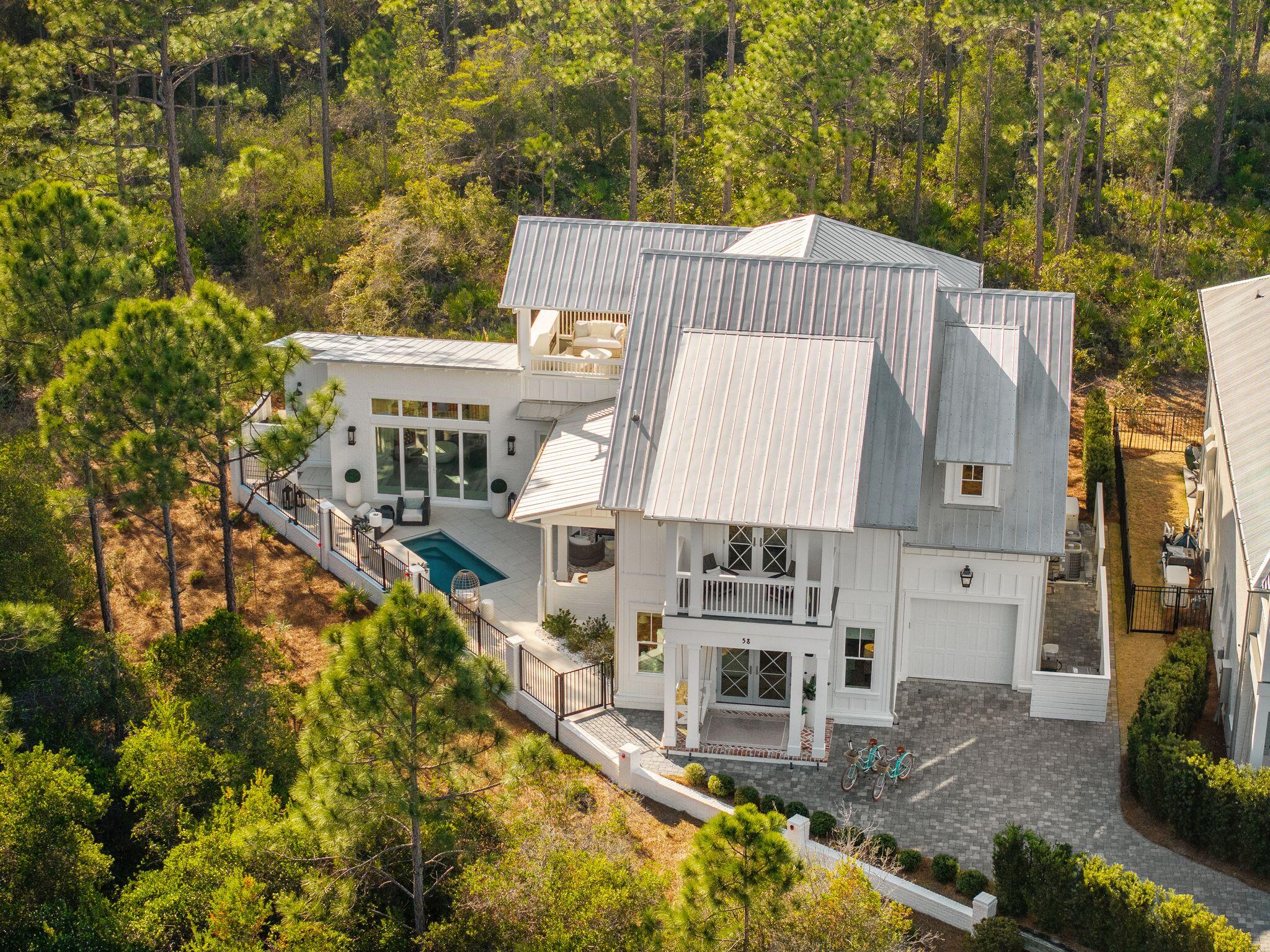 Surrounded by towering pines, against the peaceful backdrop of the state preserved Forest, this custom-built 3,400 sq ft residence offers privacy, luxury, and refined coastal living. Situated on a premium southern-exposure lot in a gated, non-short-term rental community just 1.4 miles from 30A's beaches, this 5-bedroom, 4 full bath home with an additional powder room is designed for comfort and entertaining.



The first-floor primary suite features a private sitting room, while a separate cabana with full bath and fireplace overlooks the heated pool and outdoor living area. Inside, enjoy Wolf and Sub-Zero appliances, two gas fireplaces, first and second floor laundry, whole-house generator, UV light air purification system, and infrared sauna. Surrounded by nature yet close to everything, this exceptional property offers rare seclusion with high-end amenities throughout.