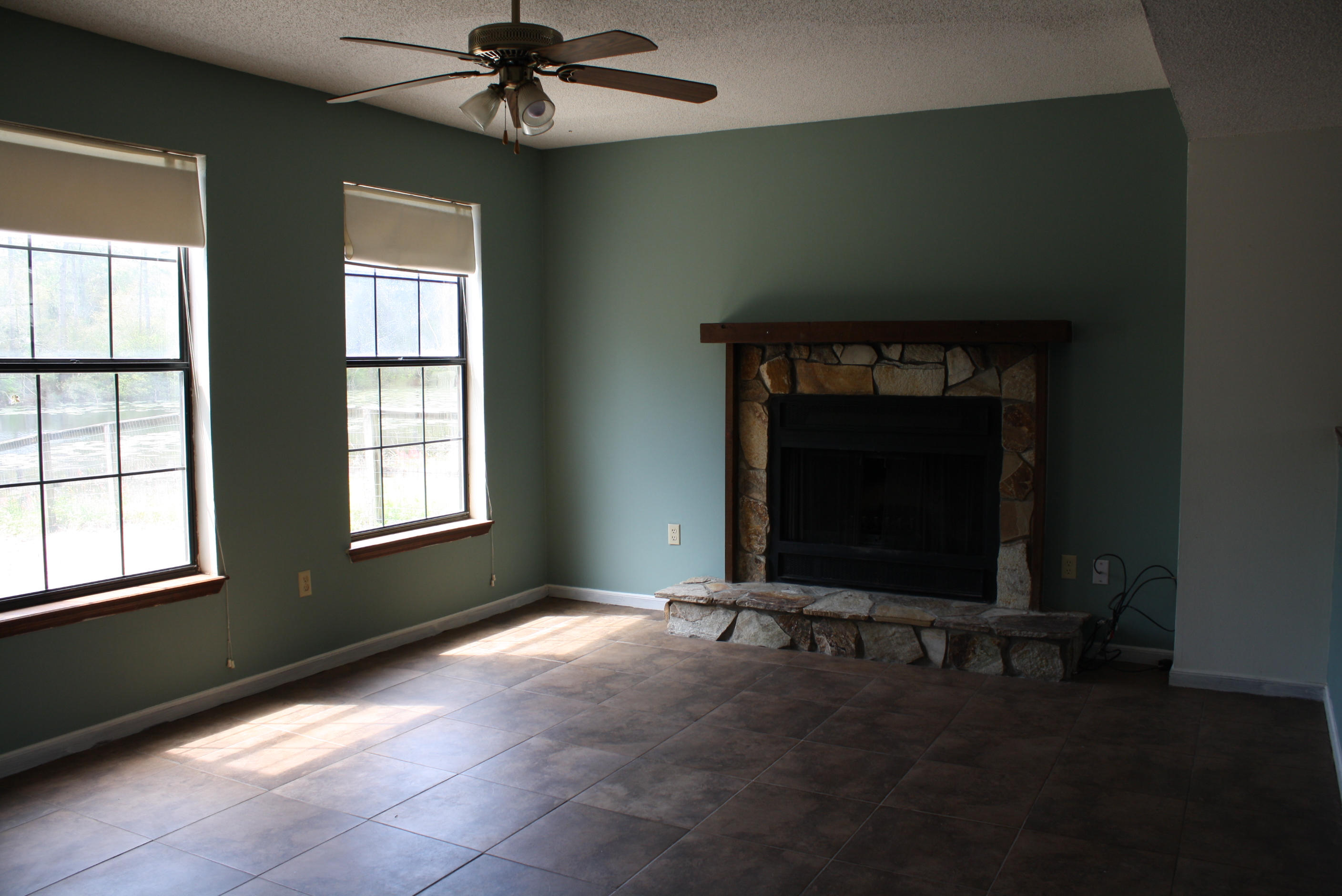 This home is conveniently located to both bases! When you enter this town home, you will see the tiled floors throughout the kitchen, dining room, bathroom and living room. The living room features a ceiling fan and fireplace. The dining room overlooks the living room and has a ceiling fan and neutral wall colors. The kitchen boasts dishwasher, electric stove and fridge. Upstairs is the washer/ dryer hookup and two very spacious bedrooms. Both bedrooms have individual sinks and dressing vanity. The backyard overlooks a lake and is completely fenced. There is a shortage building in the back for all your needs.