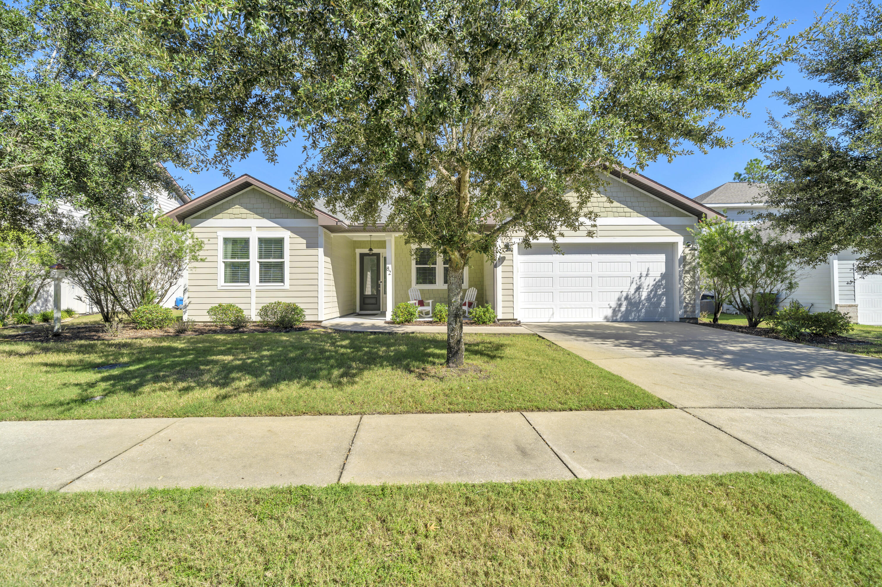 Compliments of the seller, a one year home warranty is included! l A welcomed elegance awaits at this custom-built gem, on a quiet street with pond views! Enter through 8' exterior doors to the open concept floor plan featuring 10'-11' ceilings and oversized windows throughout providing an abundance of natural light. The tranquil backyard is the perfect setting to create a cohesive living environment with the outdoors as enjoyed from the spacious back screened porch. The kitchen features a single basin sink centered on an oversized kitchen island with built-ins/deep drawers on every side; perfect for keeping gadgets and mixing bowls within easy reach. It's as practical as it is impressive, ready to handle meal prep, morning coffee chats, or the inevitable gathering spot during every party The primary suite features a comfortable sitting area in the large bedroom with custom trey lighting, a private bath w/ walk in shower featuring dual controlled, multiple shower heads, and a separate soaking tub, dual separate vanities, one with a sitting area, & a massive custom closet. The third bath for the remaining two bedrooms feature double vanities, with a doored private room for the shower area. This homes prime location within Hammock Bay puts its residence in close proximity to the town square, amenities, sports complex, and the middle school. Hammock Bay is a premier, bayfront master planned community located just 15 minutes north of the white sand beaches of the Emerald Coast. A 6,000 square foot clubhouse offers residents use of the movie theatre with auditorium seating, a full caterer's kitchen to include wet bar and dining area, childs play room, and lounge overlooking the lake and pool area. Numerous on site workout and fitness facilities, competition lap pool, additional 4 Resort-style pools, pickleball courts, tennis courts, basketball court, large playground, outdoor kitchen/gas bbq areas. A Bay front club house with fishing pier extending 500' in to the bay, an amphitheater like stage with jumbotron screen, are just a few attractions with more on the near horizon! All residents at Hammock Bay will enjoy year-round social events as well as a vibrant and active Town Center. Consider this an invitation to experience the Hammock Bay Lifestyle by contacting me today for an updated list of this months community events calendar!