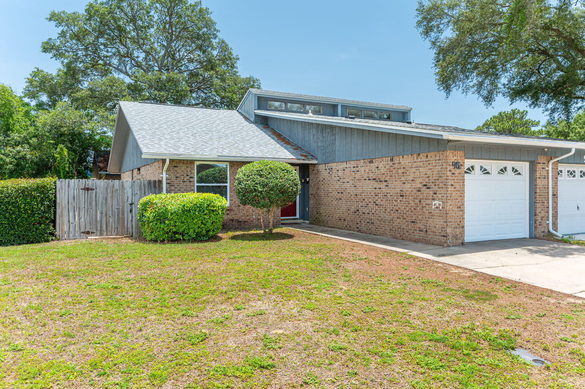 Welcome to this charming 2-bedroom, 2-bath townhome in the heart of Fort Walton Beach! Featuring vaulted ceilings and easy-care laminate flooring, this home offers a spacious and inviting layout. The fully appointed kitchen boasts ample cabinetry and storage, perfect for everyday living or entertaining. Split floor plan features a bedroom conveniently located on the first floor with a full bath featuring a tub/shower combo. Upstairs, you'll find a second private bedroom and full bath—ideal for guests or a home office. Enjoy added convenience with a single-car garage, washer and dryer hookups, and a fully fenced-in backyard for outdoor enjoyment.