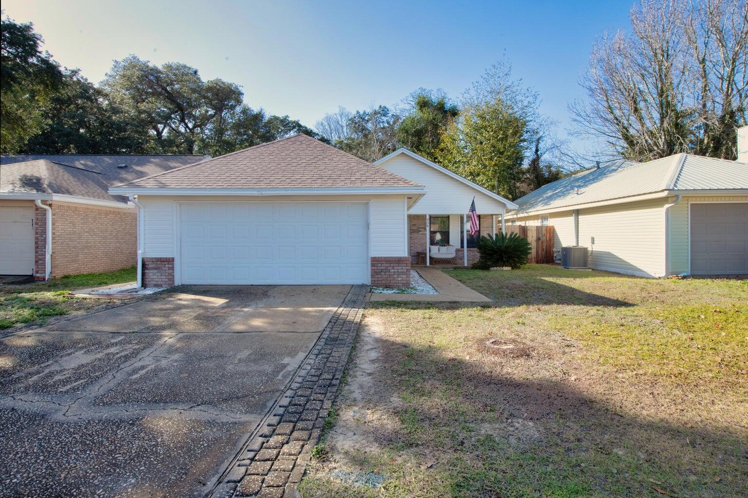 Beautifully renovated home featuring 2023 Roof, security system, flooring throughout (NO CARPET), and freshly painted! As one walks up to this home they walk up to a beautiful front porch. Continue into the renovated kitchen offering remodeled wood cabinets, gas stainless steel stove, an opening allowing a more open feel to living area, upgraded light fixtures, dining area, and pantry! The living area is well sized with a fireplace. Continuing through to primary bedroom offering oversized closets, large window, and renovated bathroom with double sinks, tile throughout, tub/shower combo! The additional bedrooms are well sized and share renovated bathroom. Wrap around to the fully fenced backyard home offers large patio, & additional yard space. Additionally, the home offers a 2 car garage.