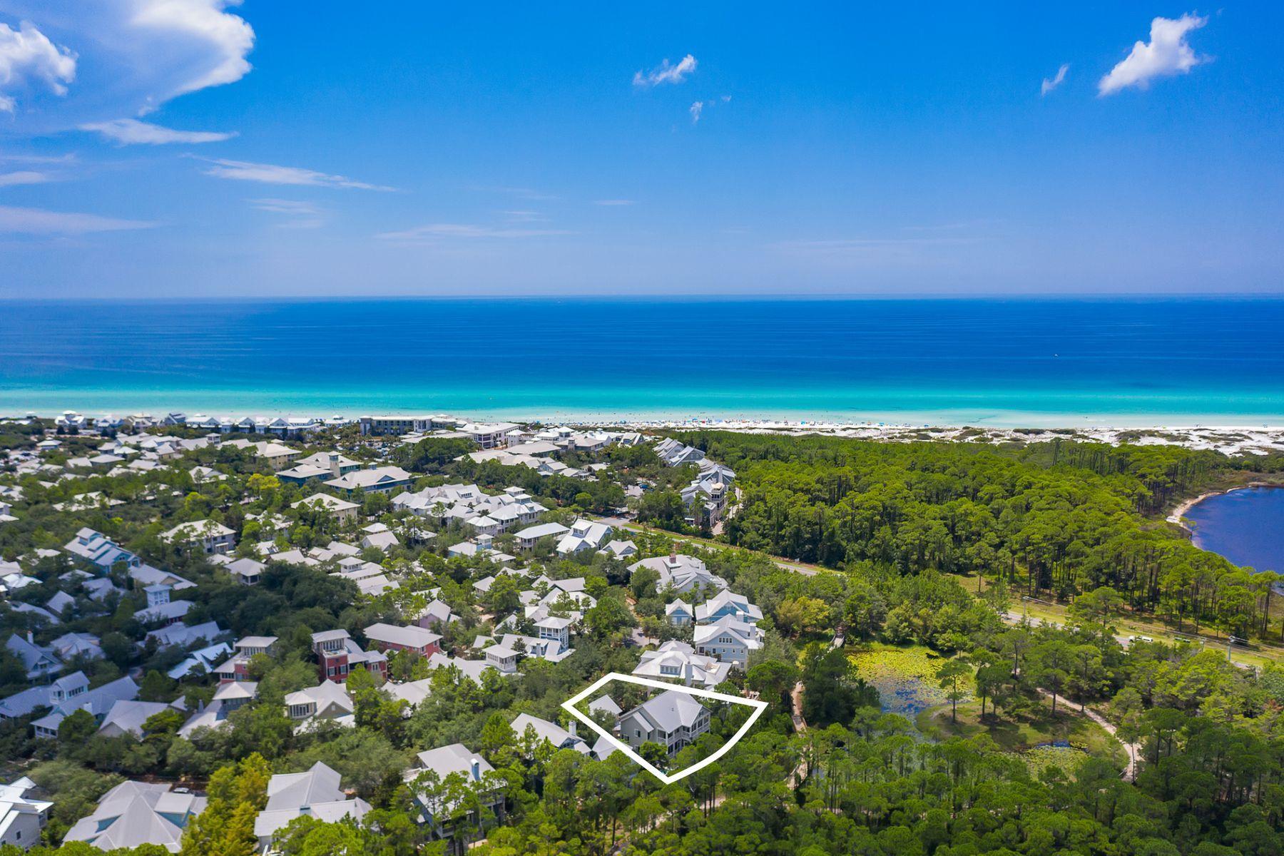 Prime positioning maximizing beautiful lake views paired with a handsome architectural facade characterize this Watercolor Phase 1 retreat optimally positioned to enjoy close proximity to the new Watercolor Beach Club. Recently updated, this beautiful home includes five bedrooms and five & one half baths including a spacious detached carriage house as well as a two car garage with an oversized parking court. Notable features include a first floor master suite with an oversized ensuite bathroom including direct access to the rear screened lanai and recently built private resort pool. The first level also offers two additional sleeping spaces as well as a beautiful foyer entryway with two staircase access points leading to the main living areas of the home. The second floor provides ample entertainment space with an oversized chef's kitchen and dining area complete with ample custom cabinetry, stainless appliances including a gas range as well as solid surface countertops. The second floor also includes a bedroom suite and a bonus room space with easy access to the western facing covered outdoor lanai offering pristine views and sunset vistas over Western lake. This home is centrally located in the heart of Phase 1 Watercolor offering easy access to the Watercolor boat house, lake front walking trails and newly built Watercolor Beach Club as well as all of the world class shopping, dining and local entertainment in nearby Seaside Town Center.