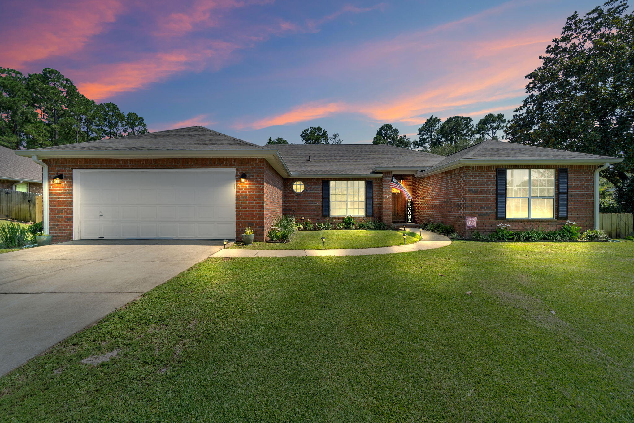 Welcome to your dream home in Holley By The Sea! This stunning 4-bedroom, 2-bathroom brick home nestled on a half-acre lot is the epitome of comfort, style, & functionality. From the wood-look flooring to the spacious backyard, this property has everything you need for modern living. As you step inside, you'll immediately notice the exquisite wood-look flooring & tile that grace all the common areas, giving the home a warm and inviting ambiance.The carpeted bedrooms provide a cozy retreat, ensuring a peaceful night's rest.The heart of the home is the kitchen, w/ stainless appliances & granite countertops that provide an elegant touch & a durable surface for all your culinary adventures. The subway tile backsplash adds a touch of sophistication to the space. Water heater 2020, roof 2019 Plus, the convenience of a pantry ensures all your essentials are neatly organized.

A formal dining room adds a touch of elegance, making it an ideal space for hosting dinner parties or enjoying intimate family meals. The spacious family room offers a comfortable area for relaxation and quality time with loved ones, making it the perfect spot for movie nights or game days.

The primary bedroom features an ensuite bathroom with a double vanity adorned with granite countertops. The garden tub invites you to unwind and indulge in a soothing soak, while the separate shower provides a quick and refreshing way to start the day.

Outside, the large backyard beckons with endless possibilities. Enjoy sunny afternoons on the open patio, shaded by a stylish pergola that adds a touch of charm to your outdoor space. With this vast expanse, there's ample room to create your very own backyard paradise, complete with a refreshing pool for hot summer days and lively gatherings.
Holley By The Sea is a community known for its tranquil atmosphere and excellent amenities. As a homeowner here, you'll gain access to the community's recreational facilities, including pools, tennis courts, and a clubhouse. Not to mention, this location is convenient to the area's beautiful beaches, providing the perfect backdrop for leisurely strolls and memorable sunsets.