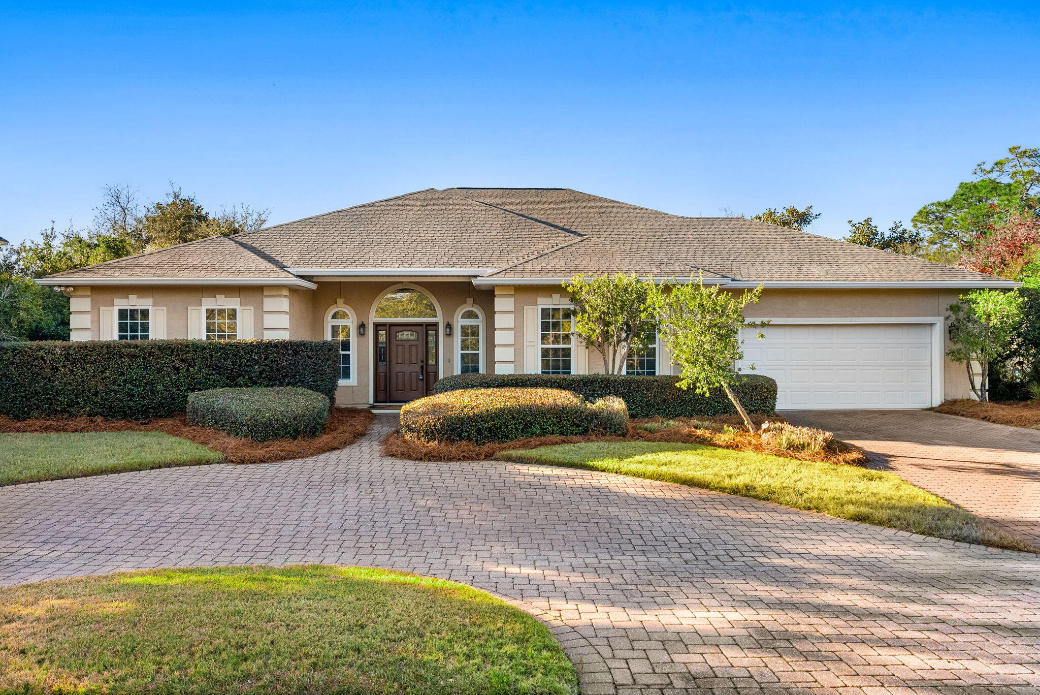 Beautifully maintained one-level home featuring a spacious open great room. The large, open kitchen is ideal for gatherings, featuring abundant cabinetry, generous counter space, and a breakfast bar. A formal dining area offers an elegant space for hosting family dinners and special occasions.

The primary suite includes two walk-in closets and a spa-like bath with dual vanities, separate shower, and jacuzzi tub. 
Step outside to enjoy Florida living at its best with a large patio overlooking the pool, providing the perfect setting for relaxing or entertaining. 

This thoughtfully designed home offers the ease of single-level living, generous living spaces, and an inviting outdoor oasis. An exceptional opportunity you don't want to miss!