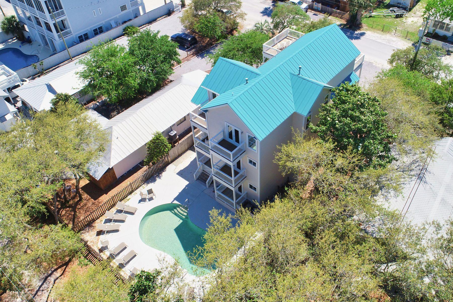 Back on market - previous buyer's inability to secure financing makes it available for you! Fabulous rental history on this classic Grayton Beach house with views of both the Gulf & Western Lake, just eight sites back from this world famous beach and The Red Bar! All baths & kitchen have been renovated! Each bedroom has en suite baths. This popular rental retreat offers everything needed for large family gatherings including a large pool with spacious sunning deck and huge bunk room w/ 4 built-in full size & 4 twin bunks and a foosball table for the kids! Individual balconies off bedrooms offer private getaways, yet plenty of room for all to lounge on huge decks just steps from world famous Grayton Beach, restaurants, and shops. The home is well-equipped for the crew with a Chef's kitchen including Thermador gas range, two Thermador dishwashers, and two side by side refrigerators and a separate ice maker. Two sets of commercial washers & dryers too and two tankless water heaters with unlimited hot water for those long showers after beach time!  Huge guest parking with room for nine vehicles!!  The house has a freshly painted exterior with recent exterior updates.  For those who like to paddle, Western Lake, 30A's largest coastal dune lake is just one block over with a dock to fish from too, or just a short stroll to beach access at end of the road. This location offers something for everyone!!  Bike to shops along 30-A or venture to WaterColor and Seaside for concerts & people watching.  This is a very popular rental home for family reunions, weddings, and business retreats. (Sleeps 23)