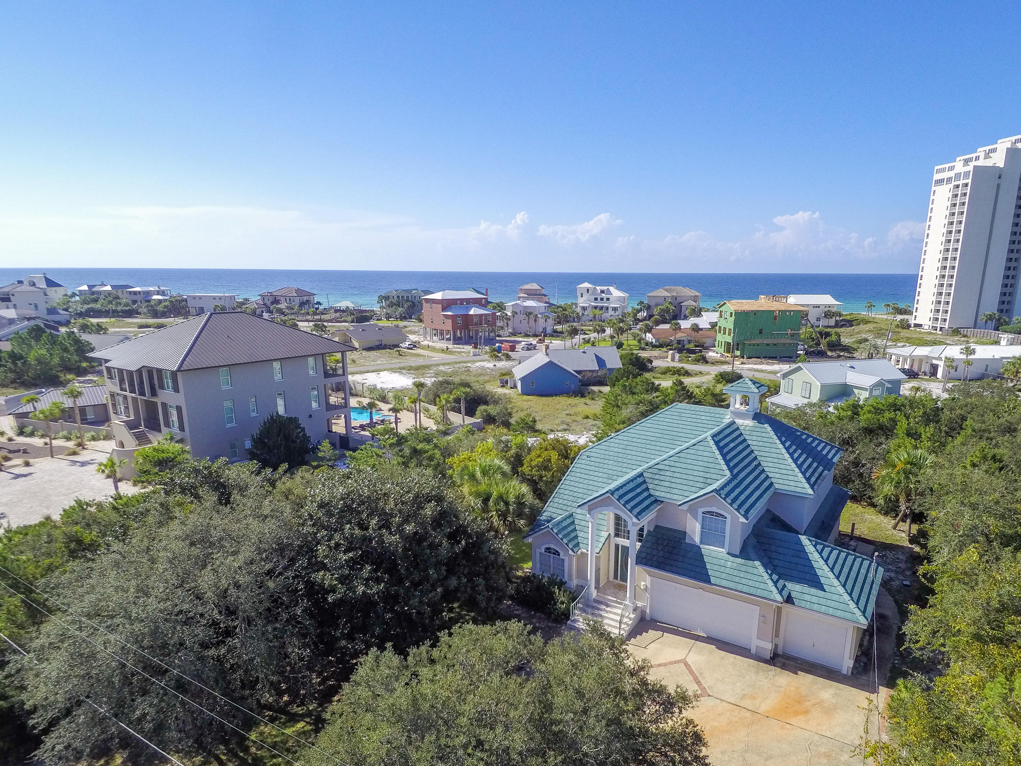 Accepting Back Up Offers! $24k below appraised value. Sitting high above the beach gulf views unfold before you. Enjoy the privacy of living in Gulf Pines, a quiet beach neighborhood in Miramar Beach, where the beach is always beautiful and never crowded. This four bedroom custom built beach home sits on one of the highest points in the neighborhood. The Living Room with fireplace and built ins features a soaring ceiling and large window allowing the room to be flooded in natural Florida sunshine. The comfortable interior spaces encourage gathering as well as places of solitude. The family room, kitchen and breakfast room are graciously sized and overlook the outdoors. The breakfast nook and living area lets on to a screened porch for Florida to expand the living area. There is over 600 sq. ft. of outdoor spaces The spacious Master Bedroom Suite is conveniently located on the first floor. The Master Bathroom boasts a double sink vanity, water closet, separate shower and large soaking tub. The additional guest bedrooms are located upstairs for maximum privacy. Two of the guest bedrooms access a balcony for sunbathing, taking in the beautiful views of the Gulf of Mexico or star gazing on a moonlit evening. This home features an oversized 650 sq. ft. attached garage for two cars and a golf cart with ample space for all of your beach toys. 
Few neighborhoods like this exist along the Emerald Coast. The beach is never crowded with approximately 1,300 feet of gulf front, and there is common access area to the lake, which is perfect for fishing. You will enjoy private beach access and the Gulf Pines neighborhood has a large common area gulf front pavilion on 100 front feet of beach for enjoyment. Neighbors gather to toast the sunset at the beach pavilion. Golf carts are one of the main modes of transportation in the community and there is ample parking at the beach for your golf cart. Gulf Pines is nestled between two resorts and is conveniently located near the Emerald Coast's finest dining and shopping. You are minutes from Silver Sands Premium Designer Outlet, Grand Boulevard, Market Shops and Baytowne Wharf at Sandestin and ten theatres at Grand Boulevard. A hospital and medical offices are nearby as well as grocery stores, golfing and tennis. We invite you to see this home that is offered by the original owner and has never been on a rental program.  $84k+ Rental Projections.