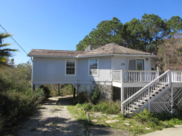 With love this 3 bedroom, 3 bath beach house with some peaceful views from the observation deck at the top of the home could be a great residence or vacation rental! Home features open living area with vaulted ceilings opens onto a screened porch and wrap around deck. Very private setting with natural landscaping and th beach access is Stallworth Beach just a short distance away. The location is convenient to beaches, schools, restaurants and all the resort has to offer.