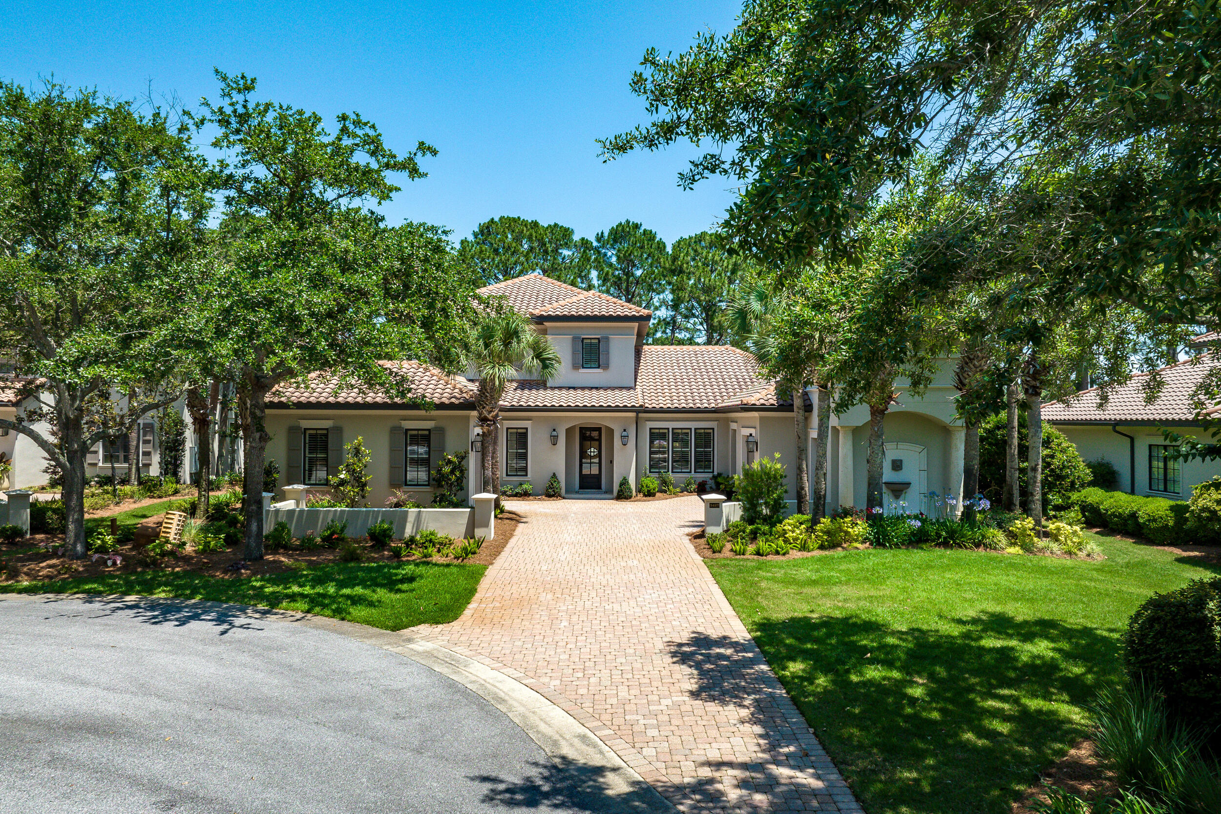 This is a SHOW STOPPER! Beautiful 4 bedroom/ 4.5 bath with a large bonus area and mother-in-law quarter, located in exclusive Burnt Pine in Sandestin. This home features an open floor plan with great outdoor living. On the first floor you are welcomed by a cathedral entry open to the second floor then a formal dining room, dreamy kitchen, and stunning living room. The living room opens to the backyard sanctuary with a screened porch, patio, pool and spa, gas fire pit and outdoor kitchen.  All of this with lush landscaping overlooking the #2 hole at Burnt Pine Golf Course. The first floor is also where you'll find the oversized primary suite to the East of the kitchen, and one bedroom and a mother-in-law suite that was converted from the 2nd garage, on the West end (note: this garage can easily be converted back to a garage).  The second floor has a large additional living space, breezy balcony overlooking the golf course, and two more bedrooms each with their own bath. The entertaining areas in this home are abundant and are sure to allow for many family gatherings, holiday get-togethers, and relaxing nights outdoors with friends.  The property offers lots of privacy, being on the cul-de-sac, and also provides extra parking when needed.  All of this AND a ton of recent updates: New pool pump and heater, pool resurfaced and new spa coping, new water heaters, new washer/dryer, new duel fuel range by Fisher and Paykel, reserve osmosis system in kitchen, new kitchen backsplash, exterior painted in 2022, new outdoor kitchen and grill, new built-in icemaker, new fireplace facing and logs, and various upgrades to light fixtures and hardware.  Also, there is great storage above the garages. Don't wait too long as this one is priced right!