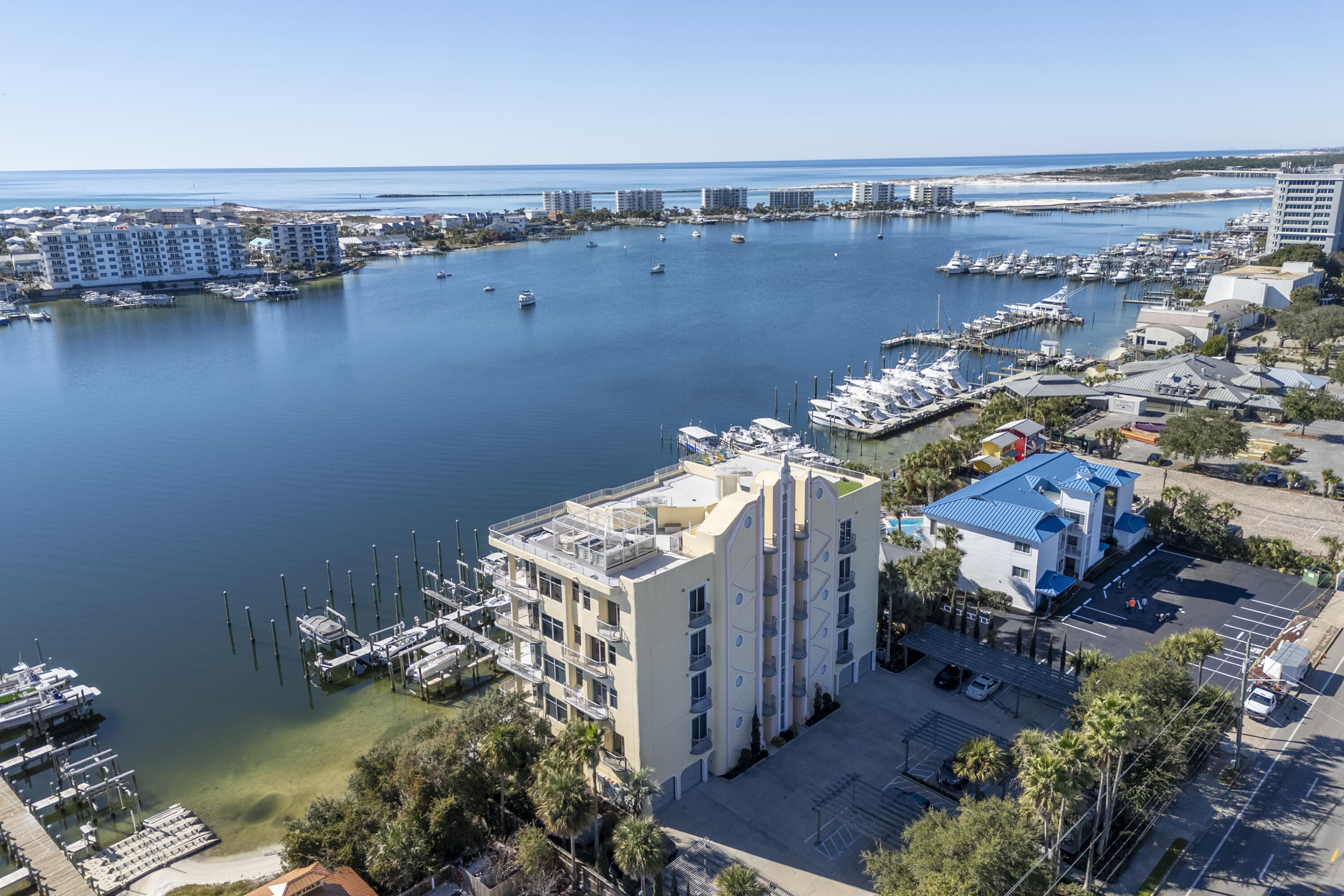 Prime two-bedroom harbor front condo available for lease with large BOAT SLIP INCLUDED at Destin Harbor Place. Located just west of Harbor Docks restaurant, this low-density condo building is perfect for full time or second home living (no short term rentals allowed). This opportunity includes a 70' x 22' boat slip, climate-controlled storage unit, heated pool, onsite fitness room & access to an incredible rooftop deck! This unique location offers an open & spacious floor plan with raised & trayed ceilings, and floor to ceiling windows to maximize the views overlooking the Destin Harbor and Gulf of Mexico. The kitchen features granite breakfast bar, island, stainless fridge & ample storage space. The expansive harbor front balcony can be accessed from the living area & primary bedroom.  This impeccable Destin condo, one of only 12 exclusive residences in a five-story condominium building is ideally located right on the water and near many conveniences. Enjoy panoramic views, weekly fireworks, sensational sunsets and an ever-changing panorama of passing boats. Entertain lucky guests on your expansive 38-foot private balcony as you dine al fresco while enjoying the gentle sea breezes. It's also the ideal spot to enjoy your morning coffee with a view. Retire to your private retreat and unwind in your soothing garden tub as you sip wine while watching the lights dance across the harbor. Living here, you'll be just minutes from shopping, dining, Harborwalk Village and everything that Destin has to offer. If you have been dreaming of experiencing the Harbor lifestyle to the fullest, now is your chance! It is rare to have access to a 70 foot boat slip too. Rental is currently unfurnished and will require one month's rent for a deposit. Pets are not allowed. Includes appliances, washer & dryer and majority of utilities are paid by owner. Electric will be paid by the tenant.