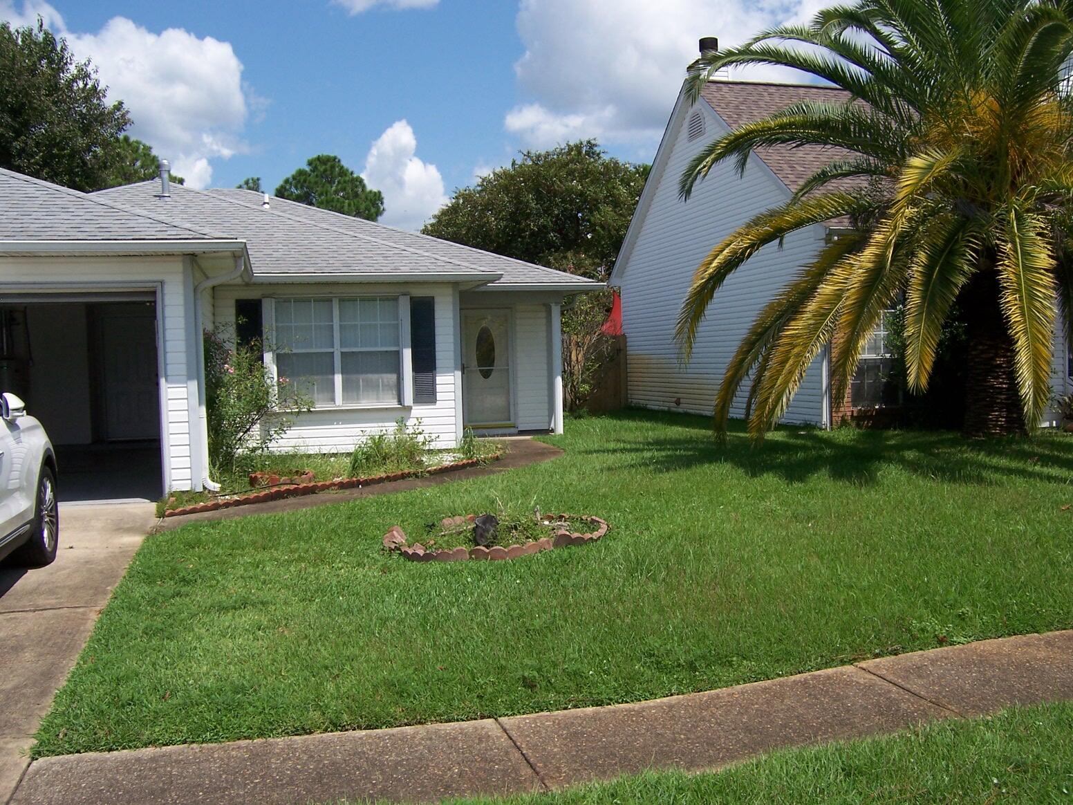Location. Location.  Located across street from Mall. Close to shops, schools and military bases.  Entrance opens to Large Family room, tile floors, ceiling fan.  Kitchen/
dining area sliding door opening to large Patio in back with Mature fruit trees.  Master bedroom, walk in closet. Master bath with Shower only and vanity.  Other two bedrooms share a full bath  All tile floor in home.