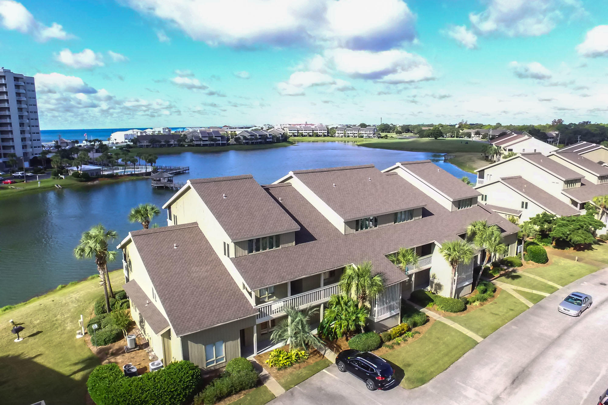 SELLER IS MOTIVATED! Come and enjoy the good life.Golf, Tennis, White Sand Beaches and Restaurants.
Lakefront 3 bedroom Boardwalk Villa units don't come on the market very often. Features of this unit are tile floors in living area and bathrooms and Carpet in bedrooms. The custom kitchen is sure to impress with solid wood Cabinetry with Granite counters in the kitchen that includes an Island for more storage space. Crown Molding graces the unit throughout. Make sure you check out the newly installed shower in the master bathroom. this two story unit has screened balconies on both levels that have Peek a Boo views of the Gulf
