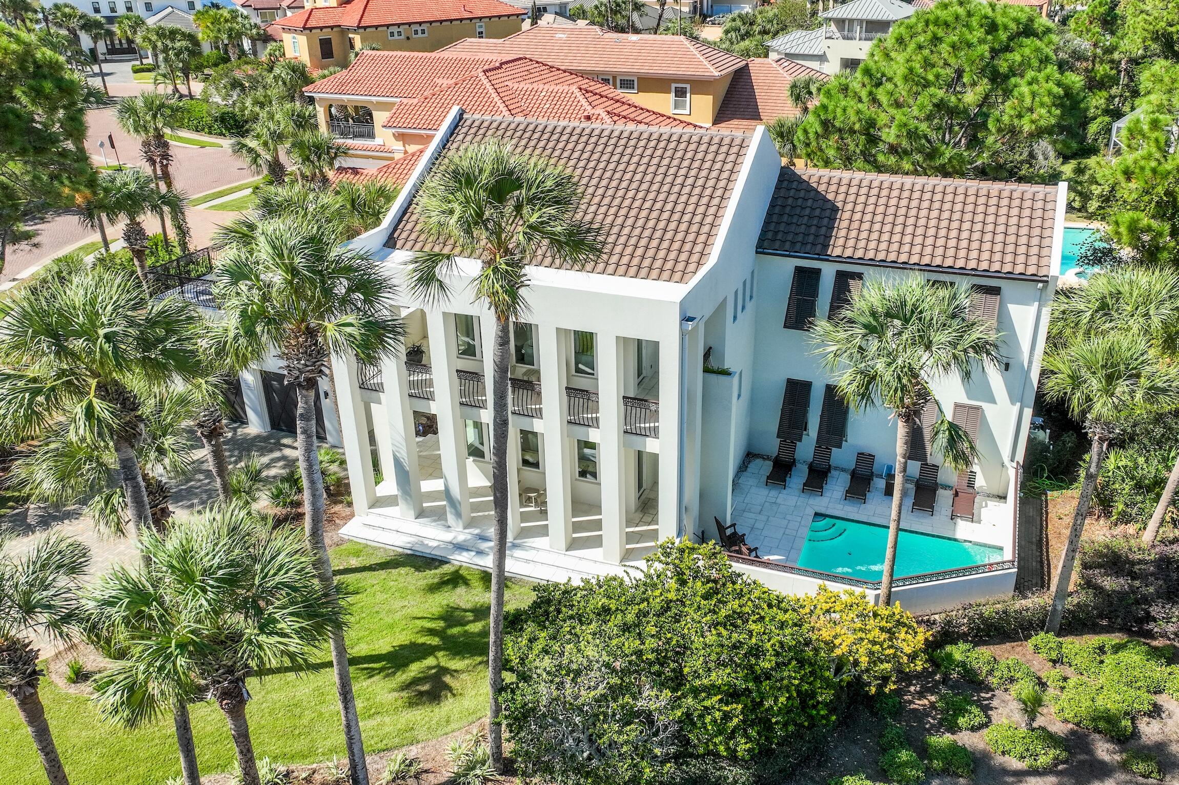 Beautifully renovated house near the beach in Destiny East.  No details were spared in the construction of the house, it features concrete walls, steel rafters, steel floor and ceiling joists, which help reduce insurance costs. The home comes fully furnished and rental ready. This home features elegant but casual living with various entertainment areas, a 24 x 24 separate balcony deck, a heated pool, a wet bar and much more. The neighborhood association has a fitness facility, two tennis courts, two swimming pools, a media room and a meeting area. This gorgeous house has also become a popular rental because of the decor, the amenities it offers and the proximity to the beach. New roof installed in 2017. Tankless water heater and new pool heater installed in 2024. The house is known on the rental market as Ocean Effect and has a 4.95 rental rating. This is the investment property that you have been looking for, great location (at the East entrance of the neighborhood), professionally upgraded and decorated interiors, offers lots of entertainment and has a proven rental record and high rental ratings from guests. Do not miss your chance to purchase Ocean Effect!