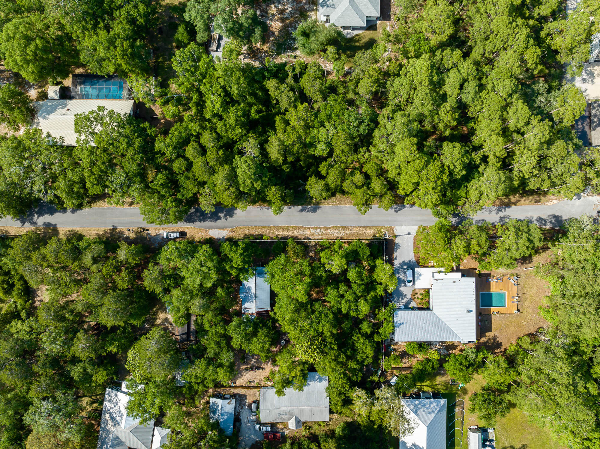 Beautifully, luscious wooded HALF ACRE vacant lot in Point Washington with NO HOA and NO BUILD OUT TIMES! High, dry, & flat! Perfect Homesite in popular and historic Point Washington with easy access to the bay, right around the corner at the public Point Washington Landing and Boat Ramp. 
This sizeable lot allows for ample building opportunities and plenty of room to install a pool.