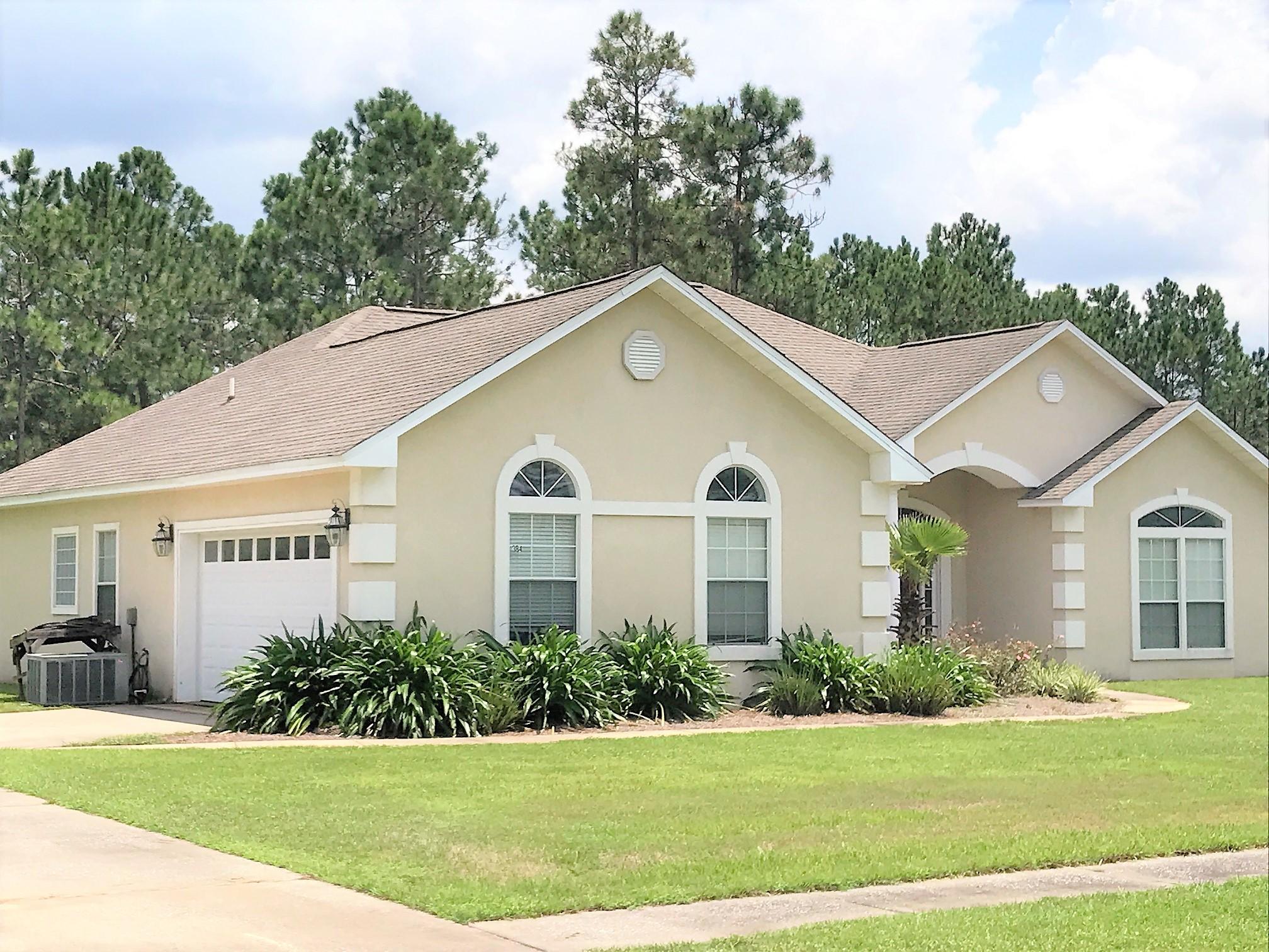 Don't miss your chance to preview this beautiful home on over 1/2 acre located 13th fairway in Windswept Estates; a gated golf community with pool, playground, basketball & tennis courts. This immaculate home has new quality wood laminate flooring installed throughout in 2015 (tile in kitchen & baths). Seller had irrigation well & full lawn sprinkler system installed in 2016. Interior features include security system, laundry room, pantry, double vanities in both full baths, formal dining, breakfast nook, breakfast bar. Other features include double sided gas fireplace; stainless steel appliances (refrigerator, dishwasher, smooth top stove, microwave & separate convection oven). Home is a split floor plan & master bath has walk-in closet, walk-in shower, as well as garden tub. Must see!