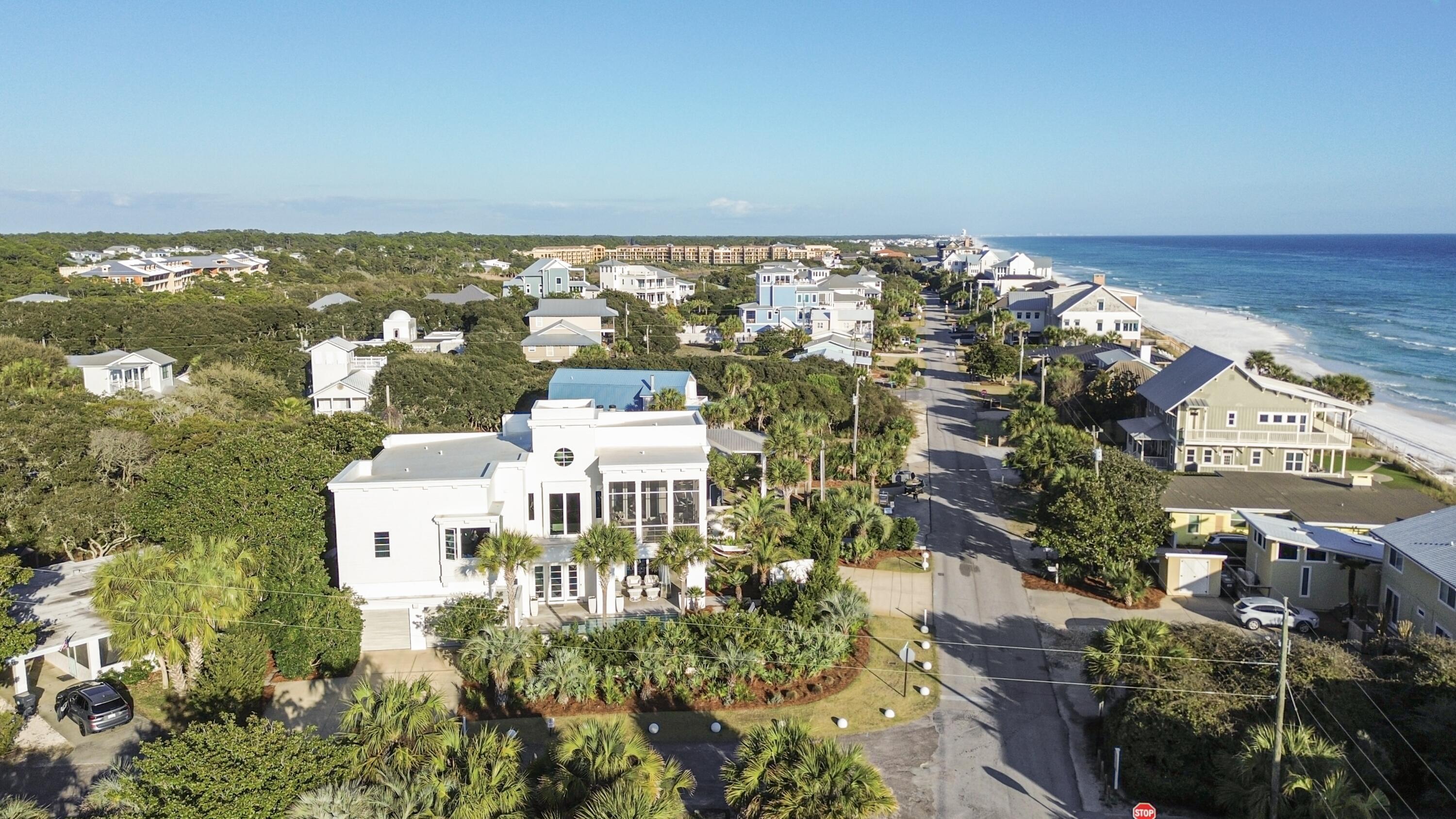 This sublime 4-bedroom, 4 full and 2 half bath modern luxury home located in Blue Mountain Beach, is perfectly positioned on its lot to capture breathtaking southwestern Gulf views and refreshing coastal breezes. Just steps from the sugar-white sand beaches via a deeded neighborhood walkover and beach access directly across the street.  This location offers both convenience and exclusivity.
Designed with clean architectural lines and timeless elegance, this fully integrated smart home showcases high-end finishes, quality fixtures, top of the line appliances, elevator, and sophisticated coastal style throughout. Spacious living areas and carefully selected design details create an inviting atmosphere ideal for both relaxing and entertaining. The home is surrounded by lush, thoughtfully curated lighting and landscaping, creating a tranquil, oasis-like setting and an unparalleled sense of privacy from many of the outdoor living areas that is rare to find on 30A.  The serene courtyard boasts a pool, hot tub, fountains, outdoor shower, outdoor kitchen with grill and a fire pit.  
Offering the perfect blend of luxury, comfort, and coastal living, this exceptional property is well suited as a primary residence, second home, or premier investment opportunity.  This home is a must see, you won't be disappointed, schedule an appointment today!