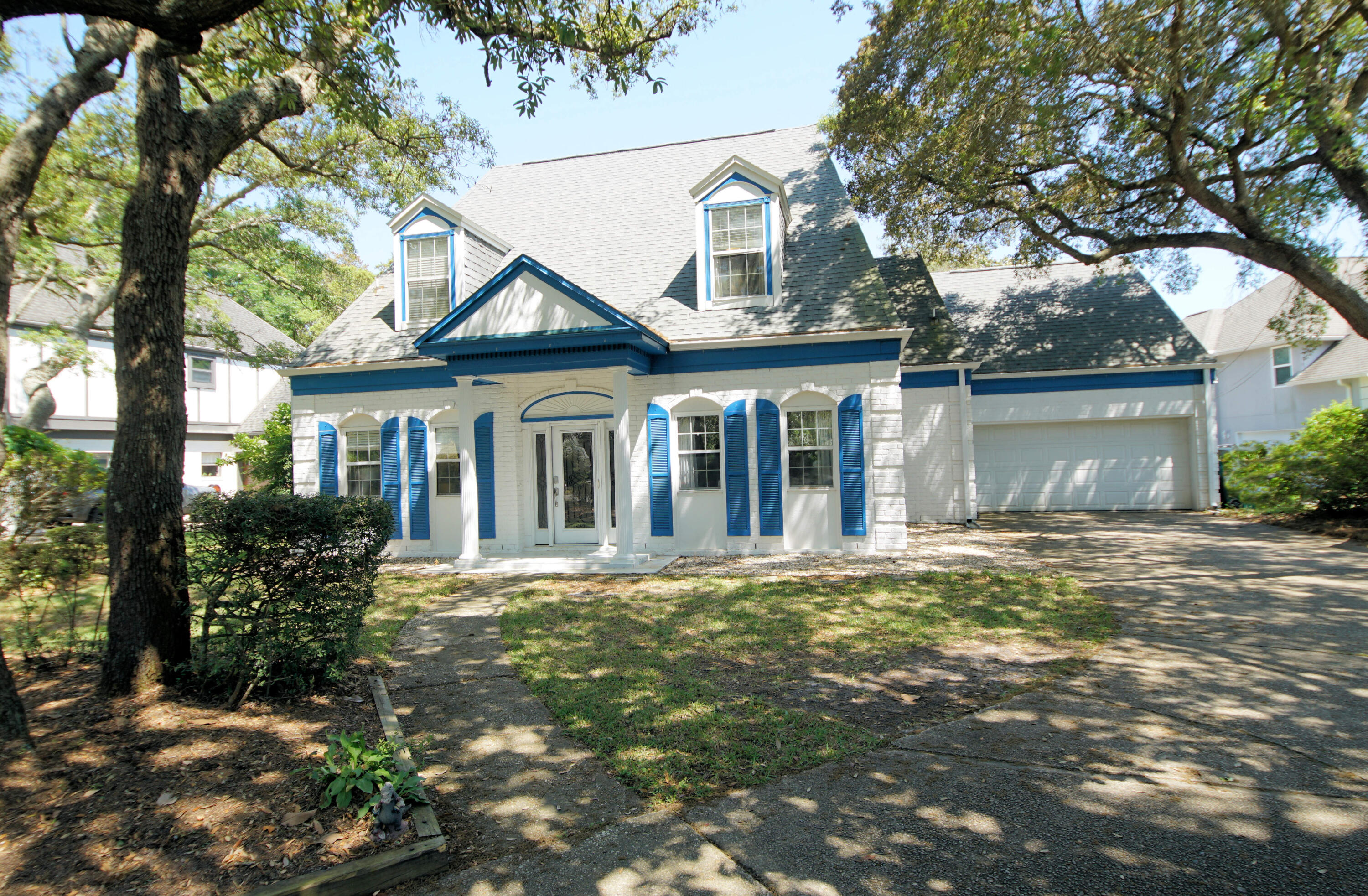 Lovely home situated on a shady oversized lot with circular driveway and views of Lake Lorraine. The home has been nicely updated to include a stunning kitchen, engineered wood flooring and bathrooms .The kitchen is a dream that features stainless steel appliances to include a gas stove, soft close cabinets, under cabinet lighting, quartz countertops and a HUGE island. The living area is open to the kitchen, making the space perfect for large family gatherings or neighborhood parties. The living area with a gas fireplace has French doors out to the screened in patio overlooking the large backyard and views of the water.  The home has 4 large bedrooms and 3 full bathrooms. The primary suite is located upstairs and includes vaulted ceilings and two walk in closets. click here for more info The spa-like bathroom has an oversized walk-in shower, dual sink vanity. There is a bedroom located on the main level with a full bathroom, walk-in shower, two large closets and an exit to the backyard and patio area. Upstairs are 2 additional bedrooms and a jack and jill full bathroom, dual sinks and tub/shower surround.
