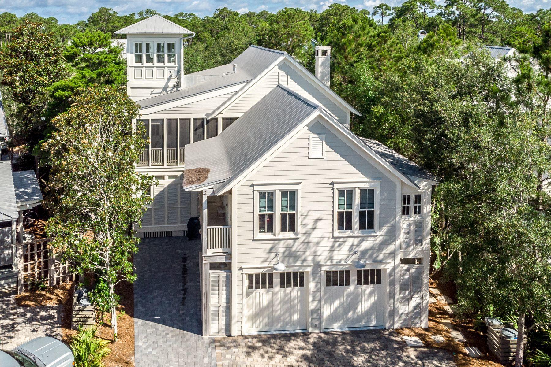 This 5 bedroom, 5 -1/2 bath home is located in Phase 1 of Watercolor. The home has been recently painted both inside and out making it light and bright! The home offers an abundance of porches, with two covered and three screened-in porches, beautiful hard wood floors, shiplap walls, plantation shutters and beamed ceilings throughout. The brick fireplace is surrounded with built in wood cabinets and offers an inviting place to gather after a long day on the sugar white sands of the Gulf of Mexico. The living room opens to both the kitchen and dining area offering a great space to gather with family or entertain guests. The kitchen is complete with a subzero stainless steel refrigerator, oversize Thermador professional gas range, hood, oven, warming drawer and microwave, kitchen-aid ice maker and wine refrigerator! The large center island with breakfast bar seating compliments the kitchen nicely.  The open living space is completed with a new modern style dining table and buffet.  Off of the kitchen is an amazing utility room.  It offers laundry just off of the back entry of the home, great for coming in from the beach or pool, along with a utility sink and pantry cabinets. The oversize first floor master suite offers a garden tub, glass shower, water closet and access to a screened-in porch. A half bath completes the first floor. Three guest bedrooms can be found on the 2nd floor, all offering their own private ensuite bath and direct access to large porches.  A cozy window seat can be found tucked behind the stairs making it a perfect for relaxing with a good book or a fun children's nook.  The third level of the home features a crow's nest  and balcony that allows for panoramic views of WaterColor and Western Lake. This home also features a spacious, appointed carriage house with vaulted ceilings, full bath, kitchen and balcony.  The property also offers a large two car garage with additional storage space and an outdoor shower. The WaterColor community includes residential homes and a newly renovated beach-side resort on the beautiful Gulf of Mexico and the breathtaking coastal dune lake, Western Lake. Quaint streets and pathways connect homes to the community parks, shops, the lake and the beach making biking, running and walking that much more enjoyable! The Watercolor community offers several resort style pools to include water slides and a lazy river, tennis courts, basketball courts, playgrounds, fitness center and a boathouse stocked with kayaks, canoes, paddle boards and fishing equipment. Call for a showing today!