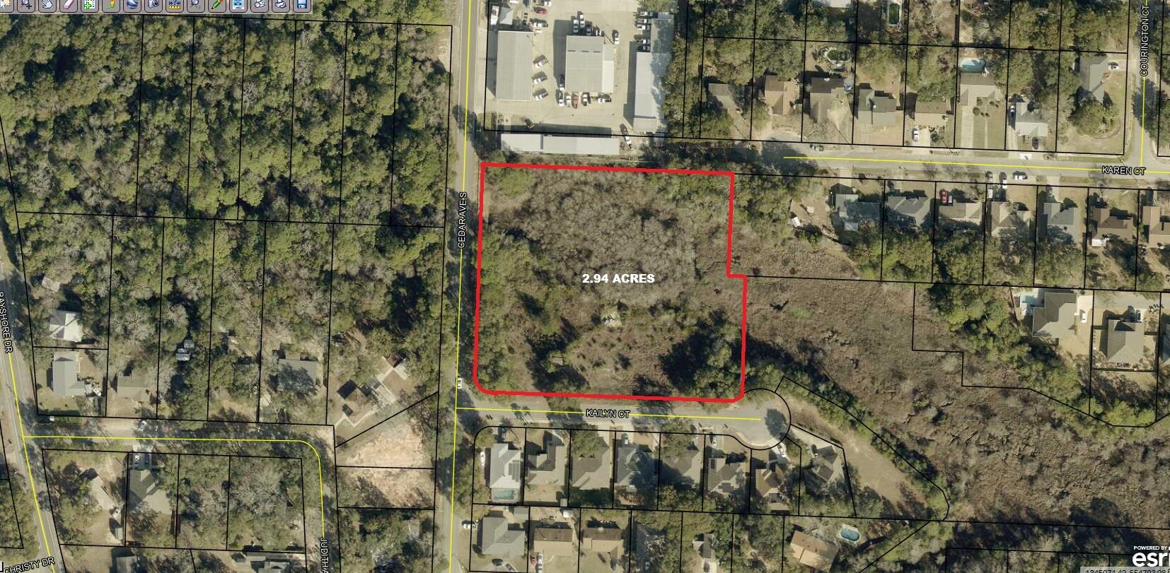 Discover a rare offering in one of Niceville's most established and desirable residential corridors. This strategically located 2.94-acre vacant parcel sits along S. Cedar Avenue—just two blocks from Choctawhatchee Bay—and is perfectly positioned for a boutique residential development or a collection of private homes.

Originally platted for 15 individual lots, the property now lends itself exceptionally well to a 4- or 5-lot configuration along Kailyn Court, offering generous homesite sizes, mature trees, and the charm of an established neighborhood setting. Utilities and public services are nearby, and the surrounding area features a blend of well-maintained single-family homes, quiet streets, and walkable access to the best of Old Niceville. Unmatched Proximity & Lifestyle Amenities:

Top-Tier Schools: All primary and middle schools are within minutes, and Niceville High School is only a 3-minute drive, making this a perfect location for families seeking placement in one of Florida's most sought-after public school systems.

Military Convenience: Just 15 minutes to Eglin Air Force Base, providing a prime location for military families and investors looking to tap into strong and stable housing demand.

Outdoor Recreation: Stroll to the bayfront in under 5 minutes, launch a kayak or paddleboard, or enjoy the nearby parks and waterfront green spaces that define Niceville's relaxed coastal lifestyle.

Central Access: Minutes to Niceville's commercial districts, medical offices, shopping, restaurants, local cafés, and the expanding Niceville-Valparaiso cultural and civic amenities.

Regional Attractions: A short drive places you at Destin's white-sand beaches, the Emerald Coast's dining and retail hubs, and the region's renowned boating, fishing, and adventure destinations.

Ideal for: small-scale developers, custom home builders, or end-users seeking an infill opportunity with substantial upside in a high-demand, low-inventory market.