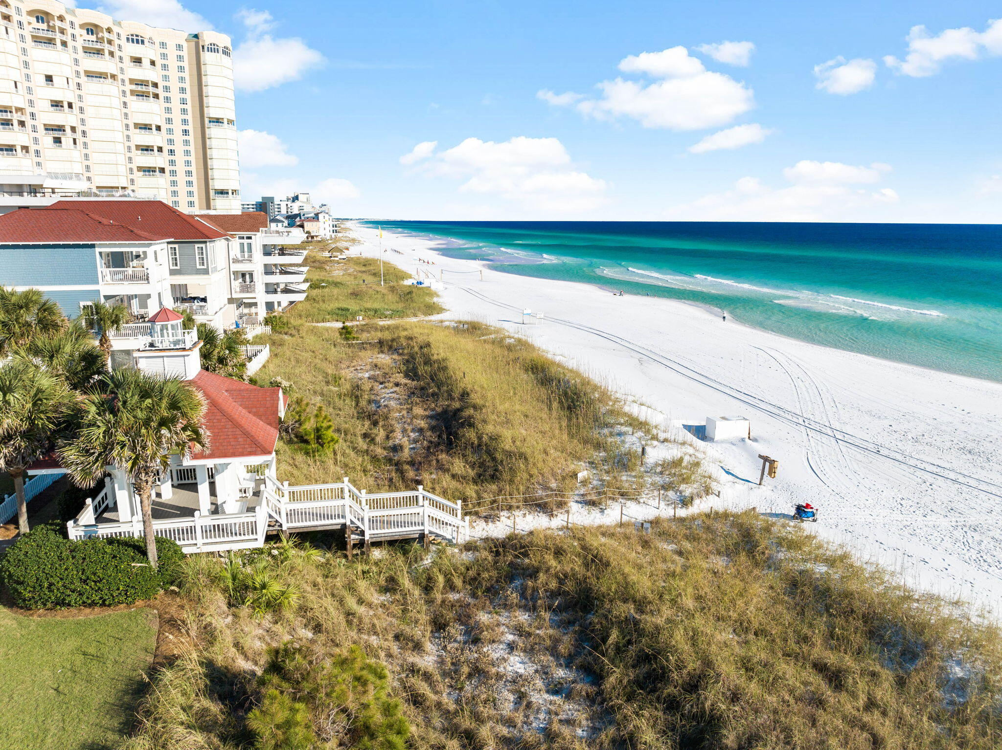 ***Only 90 Steps to the Beach*** This is one of the prettiest beach accesses in the area, located within the desirable gated community of Shipwatch.  This charming three-bedroom, three-bathroom, two-story beach house seamlessly blends coastal charm and modern convenience, offering an exceptional haven for beach lovers.  

The main house features an open floor plan designed for effortless entertaining, with a ground-floor bedroom and a luxurious master suite upstairs. French doors open to a private pool area, perfectly positioned between the main residence and the charming carriage house. The carriage house boasts a living area, kitchenette, balcony, two bunks, a king bed, and additional sleeping nooks, making it an inviting retreat for guests or family! Sold fully furnished, this property is ready for immediate enjoyment or rental potential. A spacious two-car garage provides ample storage for a golf cart, beach gear and more. With its unbeatable location, stylish design and thoughtful amenities, this home offers the ultimate beachside lifestyle.
