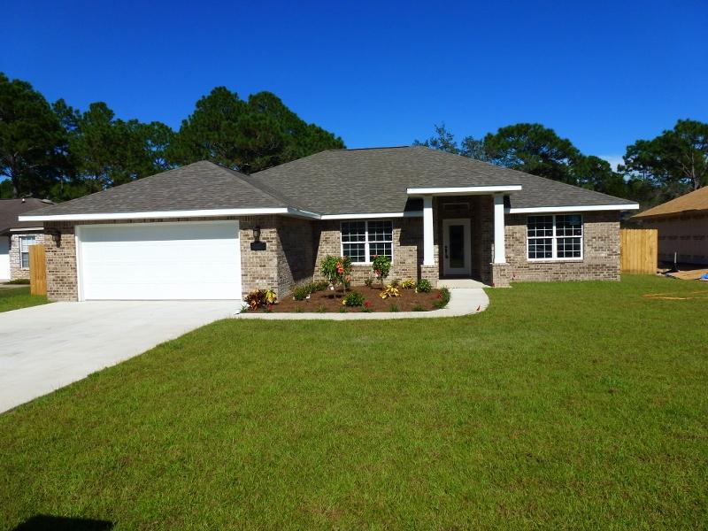 Be sure to View spectacular ''3D VIRTUAL TOUR'' of this Brand New Home That Will Be Ready for Move In 30 August 2016!! SELLER WILL ASSISTS WITH CLOSING COST. YES,THIS STAR QUALITY, CUSTOM BUILT, ALL BRICK, SPLIT FLOOR PLAN,4 BEDROOM 2BATH HOME,IS COMPLETE WITH AN ARRAY OF SPECIAL FEATURES ONE WOULD HOPE FOR. HIGH IMPACT WINDOWS, NINE-TEN FOOT LACE TEXTURED CEILINGS ACCENTED W/CROWN MODING IN LIVING AREAS (GREAT ROOM/DINING AREA/LIVING ROOM). BEAUTIFUL 48''in. WOOD DESIGN TILE PLANK FLOORING. HIGH BASE BOARDS, FINISHED BULL NOSE CORNERS, AND CEILING FANS IN EVERY ROOM. FULLY LOADED KITCHEN EQUIPPED WITH STAINLESS STEEL APPLIANCES,CUSTOM BUILT CABINETS WITH GRANITE COUNTER TOPS. RAISED BREAKFAST BAR ADDS THAT SPECIAL TOUCH WHICH OFF SETS DINING AREA/BREAKFAST NOOK AND KITCHEN. MASTER BEDROOM SUITE WITH TREY CEILING OFFER TRANQUIL OASIS WITH A TWO-AT-A-TIME PRIVACY BATHROOM DESIGN. CUSTOM MASTER BATH SHOWER, DOUBLE VANITY W/GRANITE COUNTER TOPS, AND LARGE WALK-IN CLOSET. LAUNDRY ROOM LEADS OUT TO FINISHED DOUBLE CAR GARAGE W/GARAGE DOOR OPENER. THE DOUBLE FRENCH DOORS OFF GREAT ROOM LEADS OUT ONTO COVERED PATIO, AND INTO LARGE, FULLY SOD, PRIVACY FENCED BACK YARD EQUIPPED WITH AUTOMATIC SPRINKLER SYSTEM. HAS UNDERGROUND UTILITIES TOO!!  LOCATION IS CLOSE TO SHOPPING, THE BEACH, AND ONLY 6 MILES WEST OF HURLBURT FIELD AFB. YOU WON'T FIND A BETTER HOME FOR A BETTER PRICE!  This One IS WORTH SEEING, AND WELL WORTH OWNING!