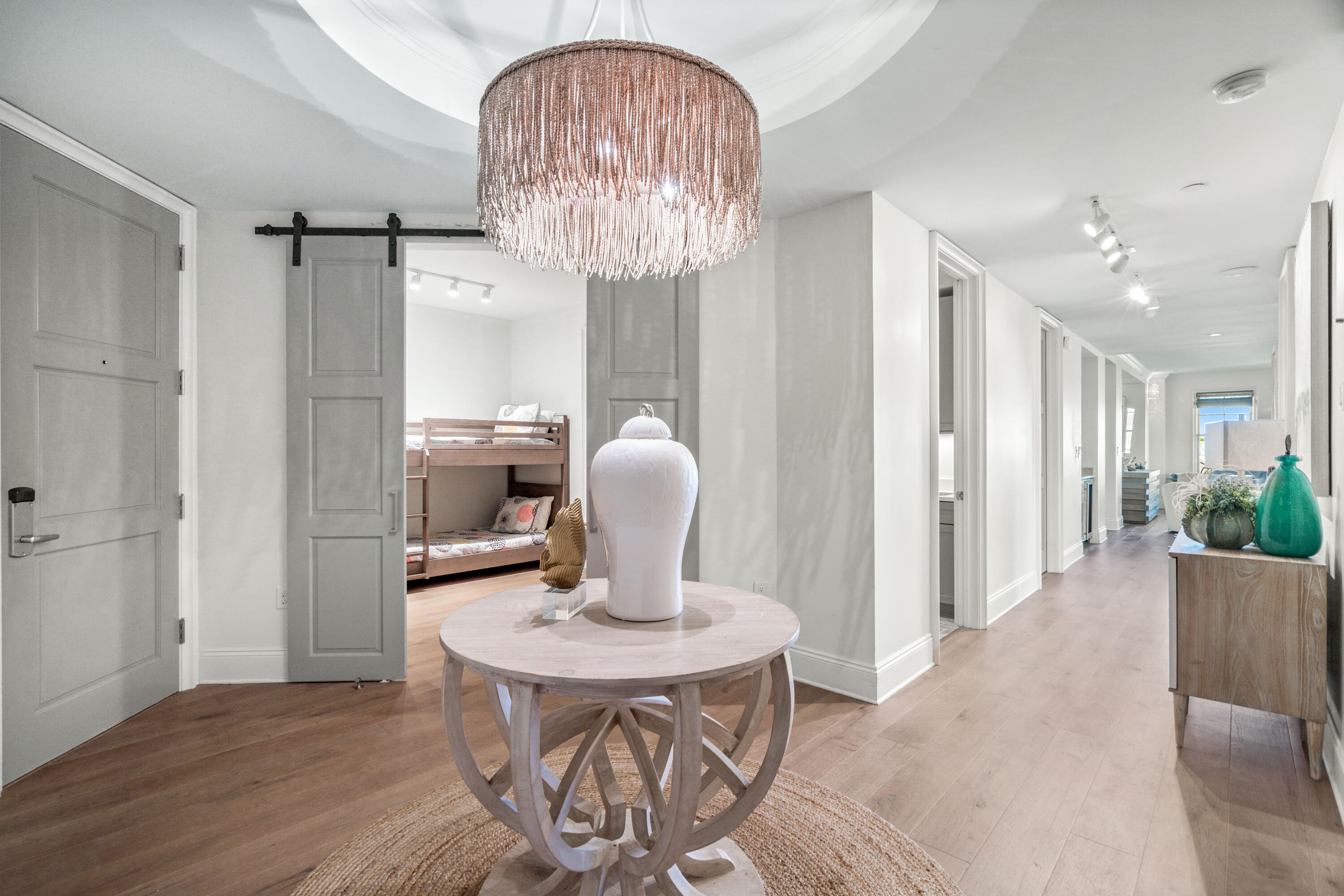 Embrace the pinnacle of coastal living at this top-floor Georgetown residence in Rosemary Beach. Boasting 4 bedrooms, including a generous bunk room, and 3 bathrooms, this unit features an open floor plan with high ceilings, bathing each space in natural light. The foyer sets the tone for elegance, leading to a kitchen equipped with top-tier appliances, including a Wolf 36' Dual Fuel range and Sub-Zero French Door refrigerator.

Luxury extends beyond with wire-brushed oak hardwood floors, Vein cut silver Travertine in bathrooms, and Quartzite stone counters. Multiple balconies, including those off the living/dining room and private balconies for 3 of the bedrooms, offering panoramic views. Professionally decorated, this residence comes with exclusive access to Rosemary's multiple beach accesses, Exclusive Owners Club, 4 community pools, tennis courts, and fitness centers, creating a lifestyle that harmonizes sophistication with recreation. This residence also offers an amazing investment opportunity with it bringing in $160k in 2023 and over $100k already reserved for 2024.