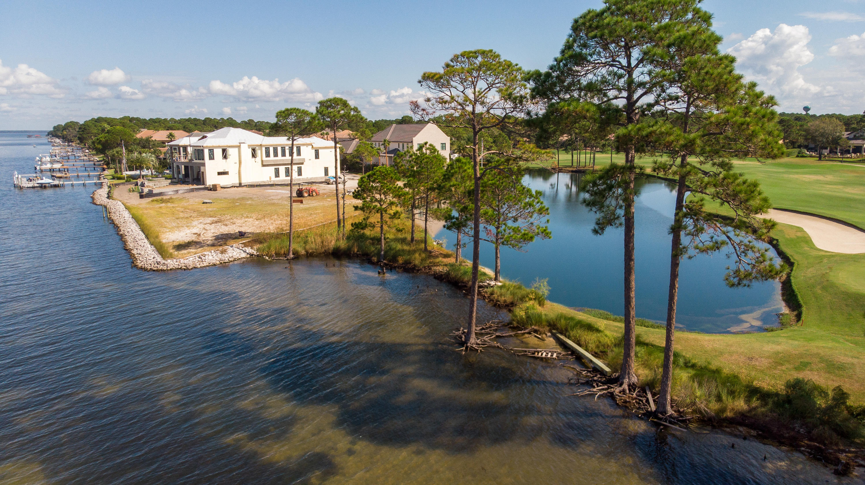 A Sunset Lover's Paradise. This is truly a unique lot within the gates of Burnt Pine. This lot not only offers 180 feet of bay frontage; it also offers the opportunity to build an estate size home with incredible views of the Choctawhatchee Bay, lake, and golf course views of the beautiful 13th hole on the private Burnt Pine golf course. It's literally the last Bayfront lot of its kind within the gates of Sandestin Golf and Beach Resort. Burnt Pine is an exclusive and gated community within Sandestin Golf & Beach Resort offering the ultimate, premier lifestyle of primary residences or 2nd homes. Owners are eligible to become members of the Burnt Pine Golf Club and are able to take advantage of the many benefits and clubs Sandestin has to offer. As an introduction to the Sandestin lifestyle, we invite our new owners to explore amenities that make Sandestin special. The listing brokerage and seller(s) are presenting the buyer(s) of this property with (2) 90-minute rounds of Tennis court time, a golf foursome at one of our three championship courses, a round of golf for up to four (4) players and an invitation to "Club Night" at the unrivaled Burnt Pine Golf Club.

Sandestin Golf and Beach Resort is a major destination for all seasons and all ages, and has been named the #1 resort on Florida's Emerald Coast. This magical resort spanning over 2,000 acres is comprised of over 70 unique neighborhoods of condominiums, villas, town homes, and estates. The resort features miles of sandy white beaches and pristine bay front, four championship golf courses, a world-class tennis center with 15 courts, 4 resort swimming pools (and 15 private neighborhood pools), a 123-slip marina, a fully equipped and professionally staffed fitness center and spa, meeting spaces and The Village of Baytowne Wharf, a charming pedestrian village with events, shopping, dining, family entertainment and nightlife. For true golf cart community living, Grand Boulevard is just outside the resort gates and provides access to additional shopping, dining and entertainment for all without traveling on Hwy. 98. Come to Play, Stay for Life!