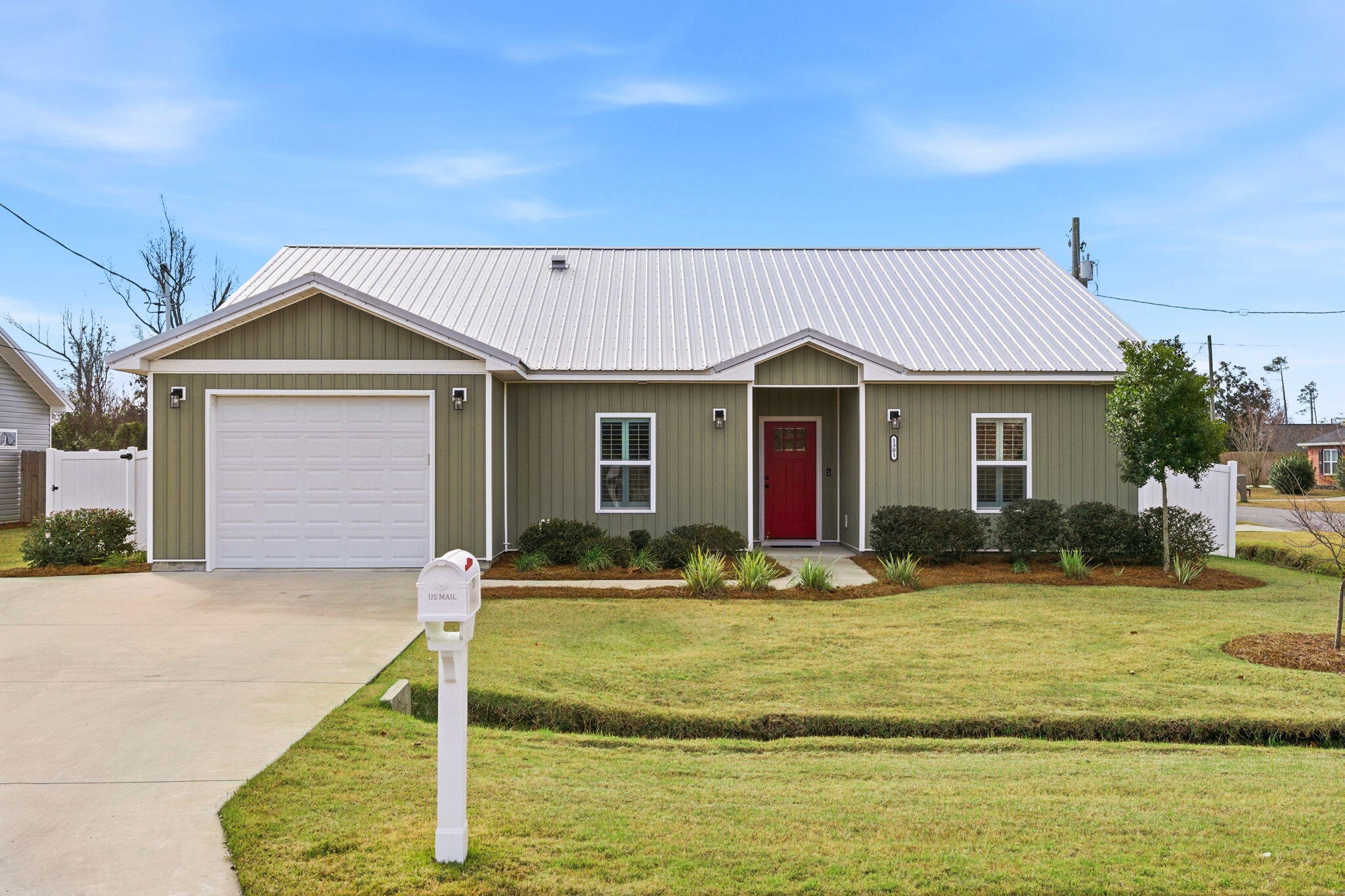 This home just feels right from the moment you step inside. Built in 2022 and impeccably maintained, this 3-bedroom, 2-bath home sits on a corner lot and is truly move-in ready. Hardwood floors (less than a year old), plantation shutters, and subtle farmhouse touches give the space a clean, modern look that's both warm and timeless. The fully fenced backyard features a double gate and side entrance, offering flexibility and privacy. A one-car garage includes overhead storage you can actually stand in, plus an additional parking pad for guests or extra vehicles. With a metal roof, hard-wired security system, and pride of ownership throughout, this home is as well-kept as it is charming. An easy one to love and a must-see in person... Call to see the home today!