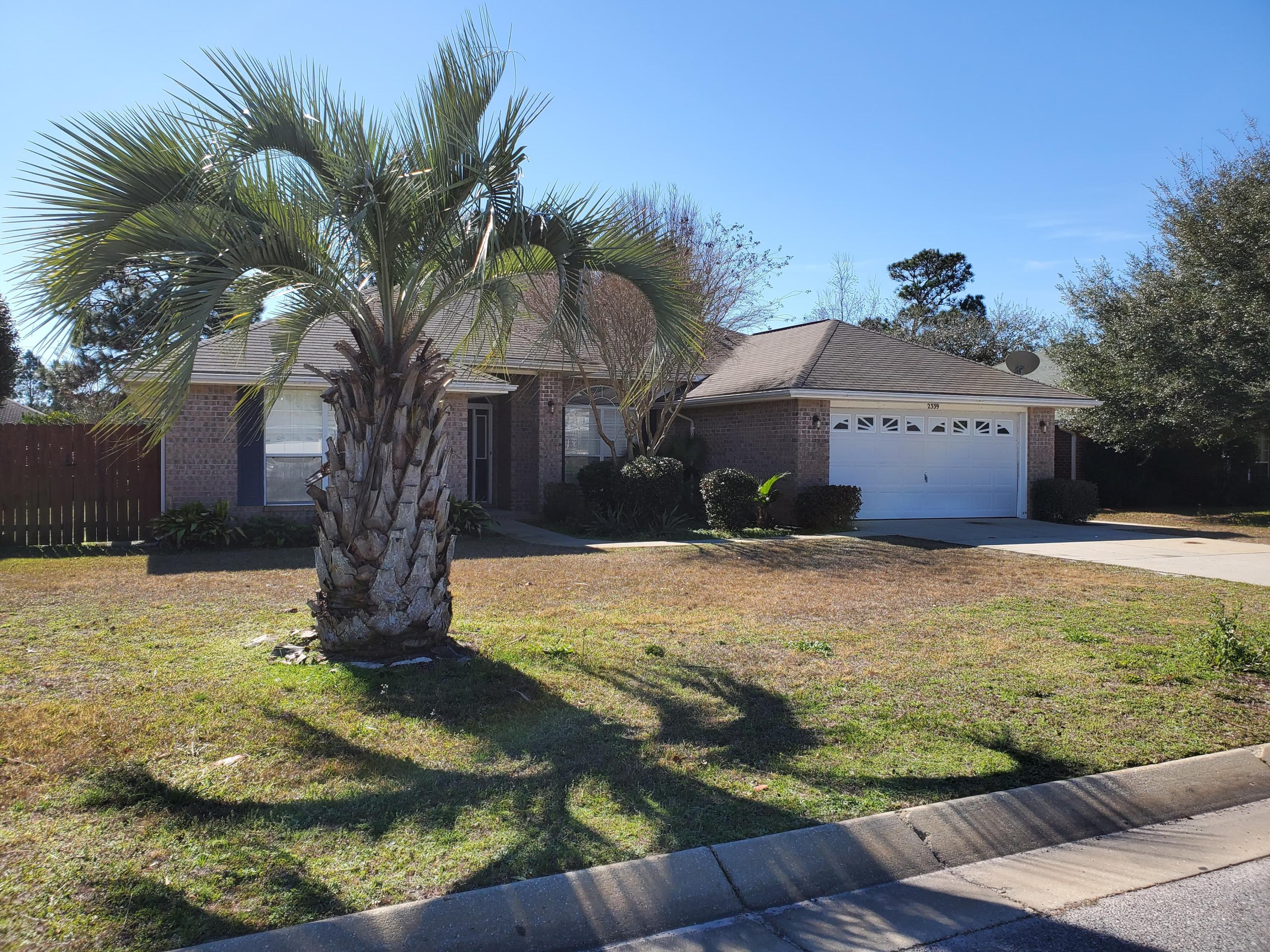 RENT INCLUDES LAWN SERVICE & TRASH COLLECTION. Awesome home in East Navarre with easy access to HWY 98 and only minutes to the beautiful sugar-white, sandy beaches of Navarre Beach. Very nicely located just minutes from Hurlburt Field, the local YMCA and Navarre Youth Sports Association. This split floor plan home is move-in ready with upgraded features, open concept living, newer appliances (washer & dryer included), eat-in kitchen and formal dining room, plantation shutters throughout and enclosed/screened-in Florida room within a fully fenced back yard. Lot and room dimensions are approximate. Owner paid lawn service and trash collection.