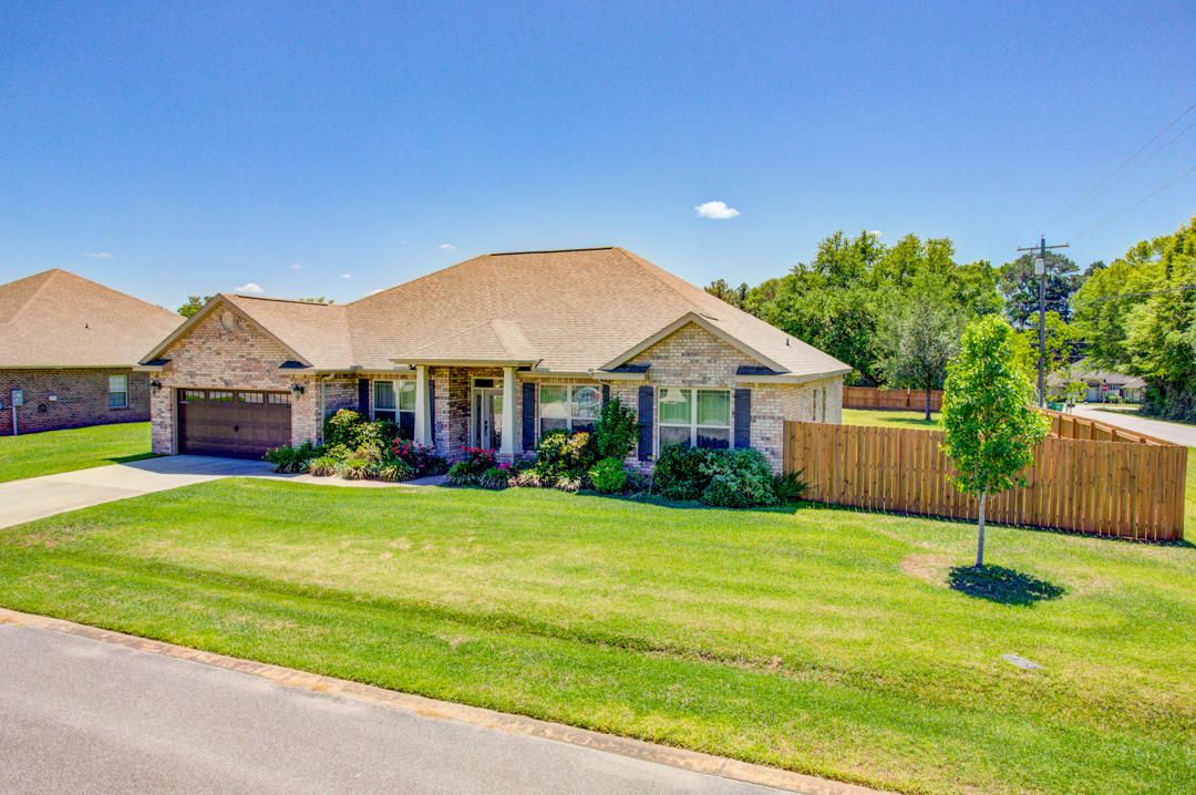 IMMACULATE home built by Watree is Gorgeous Inside and OUT! Sitting on a level 1/2 Acre corner lot with mature landscaping, privacy fenced back yard, sprinkler system, and UPGRADES galore inside! Located in North Crestview away from all the traffic yet convenient to schools, restaurants, and grocery stores. 4 Bedroom, 3 Bathroom, 2,400+ sq.ft. is MOVE-IN ready! Step into your tiled Foyer with Dining Room on your left and Den/Office on your right. Living Room features a lighted tray ceiling, laminate wood flooring and opens up to the kitchen and breakfast nook with tiled flooring. Chef's DREAM kitchen with granite counters, double ovens, smooth cooktop, soft close drawers, tumbled stone backsplash, and breakfast bar. SCHEDULE YOUR VIEWING TODAY! Private Master Suite with tray ceiling and laminate wood flooring.  Master Bath with Double vanity, soaker tub, separate shower, and walk-in-closet.  On the other side of the house is bedrooms 2 and 3 which share the 2nd Full Bathroom with cultured marble Double Vanity.  Bedroom 4 and 3rd Full Bathroom are located at the back of the house and is a perfect private Guest Suite with quick access to the Back Porch.  Enjoy your lush green back yard sitting under the covered back porch and plenty of room to add a pool. Whole house surge protector (located next to the circuit breaker box in the garage), and a separate surge protector for the outside A/C unit (located on the outside power box to the A/C unit). Seller is offering a $450 home warranty and help with some closing costs. Buyer to verify all information important to them as square footage and school information taken from public information.