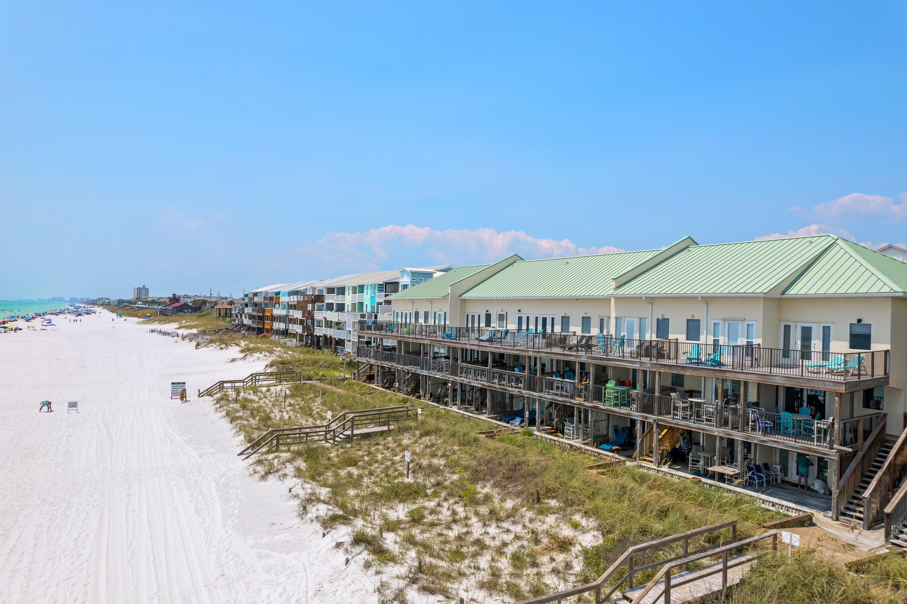 Rental projections up to $122,000! It's perfect for an investment property with rentals on the books already, or as a primary or secondary home.  This beachfront townhome comprises 3 bedrooms and 3.5 bathrooms, with an exceptional layout designed to maximize comfort and privacy. An exclusive feature is the self-contained guest quarters on the first floor, complete with a supplementary living area and a well-appointed full kitchen.  

This is an extraordinary opportunity to own a unique Gulf-front corner townhouse nestled within the sought-after Costa Del Sol community.  Revel in the coveted location of this splendid three-level residence, poised gracefully along the pristine shoreline of the Gulf of Mexico. Behold sweeping, uninterrupted views of the azure Gulf waters from each of the three balconies.  Then just steps away is a private beach area offering an idyllic escape for tranquil relaxation.  

The main level unveils an expansive living space and a sunlit nook, seamlessly connected to a private covered deck. Here, you can relish the pleasure of dining al fresco while indulging in the breathtaking panorama of the Gulf. The kitchen is tastefully outfitted with top-of-the-line GE appliances, sleek granite countertops, and bespoke painted cabinets, offering both style and ample storage. The dining area, perfectly positioned to make the most of the property's prime location, provides a stunning backdrop of the beach, enhancing every mealtime.

Ascending to the top floor, you'll find the primary and guest bedroom. The primary bedroom boasts spacious proportions and unobstructed Gulf vistas, complemented by a secluded balcony, where you can savor your morning coffee as well as the serene sunsets. The convenience of an ensuite bathroom and a neighboring laundry area enhances the functionality of the primary suite. An additional guest bedroom and bathroom on this floor ensure ample accommodations and individual privacy for residents and visitors alike.

This captivating property is offered fully furnished, allowing you to move in or begin renting seamlessly and immediately relish the coastal lifestyle. Included are two designated parking spaces, granting convenience and ease of access. Moreover, the ownership grants you the privilege of 15 feet of deeded beach space, along with multiple storage facilities.

For owners, the added benefit of LA DOLCE VITA membership offers 2 to 3 weeks of complimentary chair setup annually, ensuring leisure and comfort during your visits. For those interested, owners have the option to engage LA DOLCE VITA for seasonal chair arrangements for potential renters.

Approximate room dimensions are provided, and prospective buyers are encouraged to verify the details independently to ensure accuracy and satisfaction. Embrace this rare chance to own an elegant Gulf-front residence that harmonizes luxury, convenience, and natural beauty in an exclusive Miramar Beach locale.