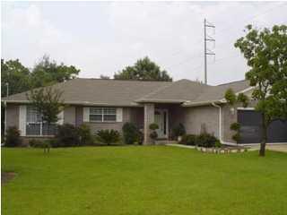 STUNNING CONTEMPORARY BRICK HOME SITUATED ON A LARGE CORNER LOT IN THE HOLLEY BY THE SEA COMMUNITY WITH LOTS OF AMENITIES! Open and spacious great room with cathedral ceiling, tiled corner fireplace with accent mirror and recessed light above the mantle, plant ledges and a sliding glass door that leads you to your all weather enclosed Florida room. Sitting area off the living area. Formal dining room with arched doorways that set it apart from the living area. You'll love this kitchen with lots of cabinets and counter space, upgraded appliances, pantry and center island with power and breakfast bar. Master bedroom suite and bath with double vanities, garden tub, separate shower and two walk-in closets. Split bedroom floor plan allows for privacy from the kids or guests. Large inside laundry room complete with a utility sink.  Holley by the Sea is a reflection of your lifestyle.  Perfect home for your family... close to military bases, restaurants, airports, beaches, shopping, churches and great schools.