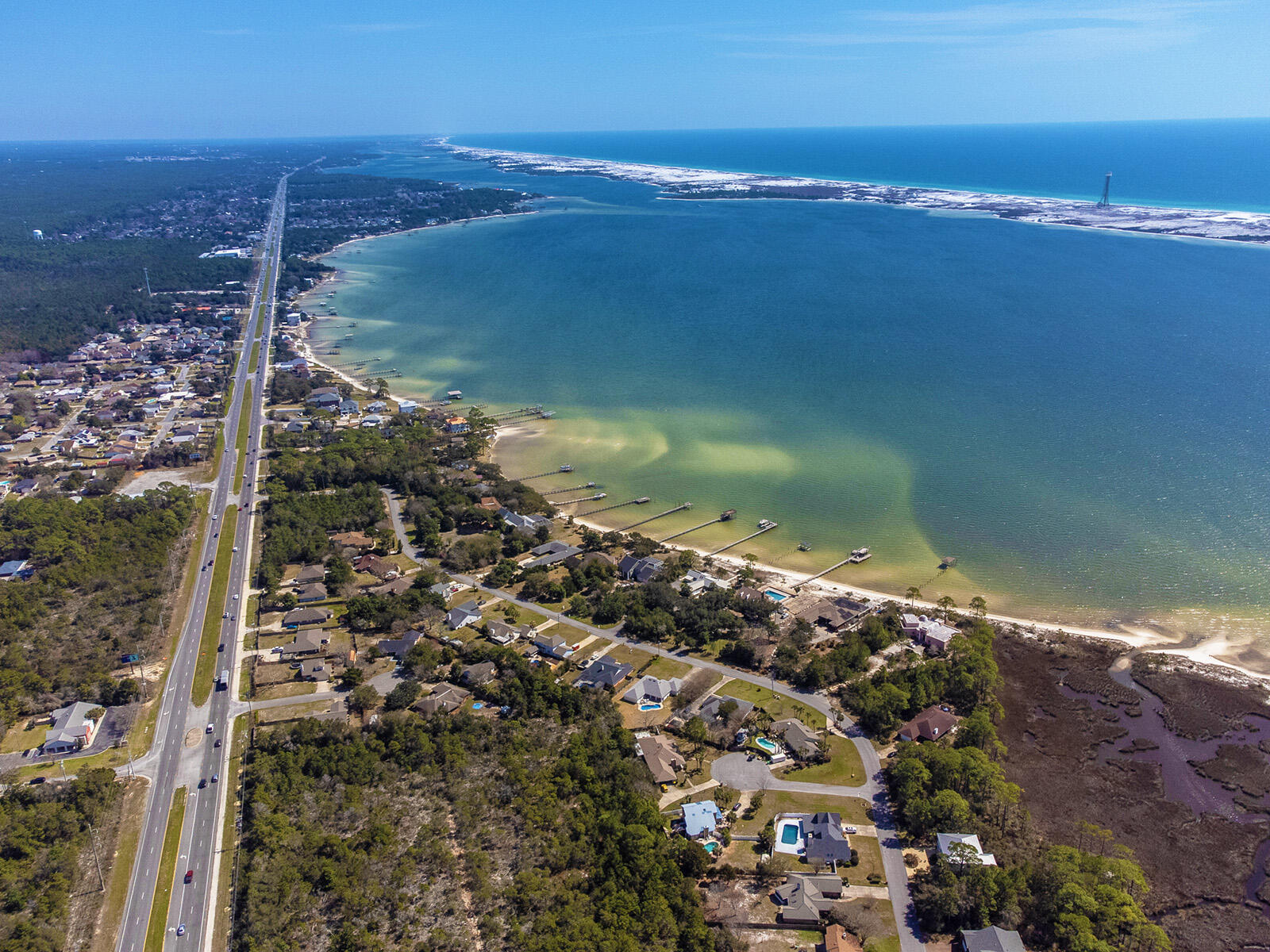 Build Your Dream Home with Stunning Water Views! This .29-acre lot offers unobstructed views of the Sound with the Gulf of America in the distance, all at a fraction of the cost of direct waterfront property. Imagine starting your day with breathtaking sunrises, unwinding on your private balcony, and soaking in vibrant sunsets over the water.

With space for a second or third-story home, you can maximize the panoramic views and coastal breezes. Conveniently located to shopping, top-rated schools, and Hurlburt Field Air Force Base, this lot combines tranquil Gulf Coast living with easy access to everyday essentials.

Don't miss this opportunity to bring your vision to life in this exceptional location. Call today for additional details and walk the lot with your favorite Realtor®!