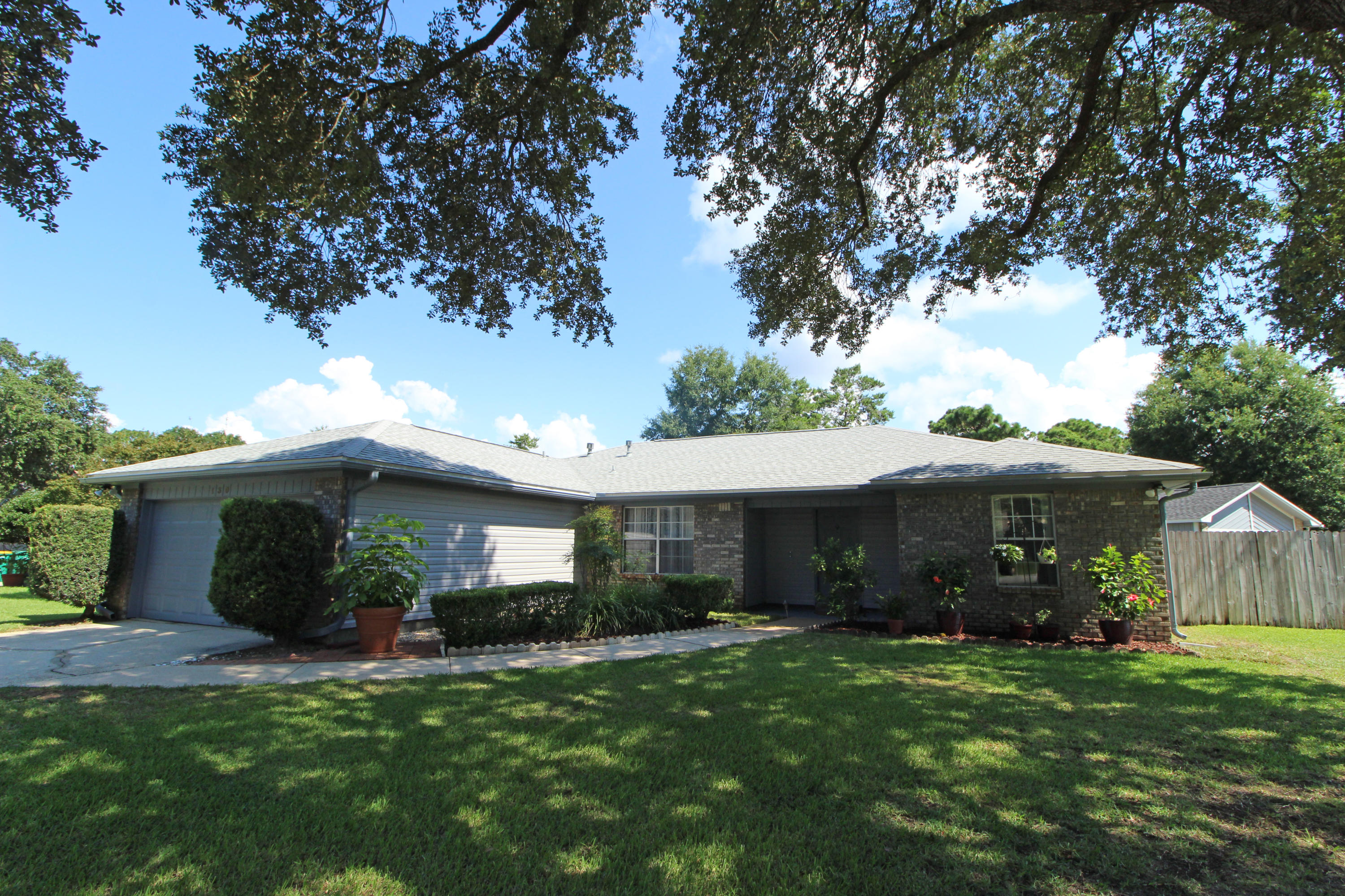 PRIDE OF OWNERSHIP SHOWS THROUGHOUT! Fantastic family home situated on a large corner lot in the desirable Meadow Woods neighborhood. Spacious living room with cathedral ceiling, corner fireplace with mantle and a French door that leads out to the open patio and backyard. Dinner parties will be a delight in your formal dining room with chair railing and trey ceiling. Light and bright eat-in kitchen with lots of cabinets and counterspace, upgraded appliances to include a gas stove, pantry and breakfast bar. Breakfast area is perfectly placed in a bay window overlooking the lush green backyard. Master bedroom has trey ceiling. Master bath suite has granite counter tops with double vanities and a make-up station, walk-in closet, separate room with shower/tub combo and toilet. Split bedroom floor plan allows you additional privacy from guests and children.  Two additional bedrooms and a full bath with an extended vanity complete this perfect package.  Both the front and backyard is beautifully landscaped and fully fenced with a lawn pump and sprinkler system.  Many upgrades and features including new siding in 2017, 4yr new HVAC system, 5 year new roof, water treatment system throughout the house, work bench and cabinets in the garage convey and much, much more.....  Close to the Mid Bay bridge to Destin and the beaches, shopping, restaurants, schools and both Eglin AFB and Duke Field.  Call today and start packing......