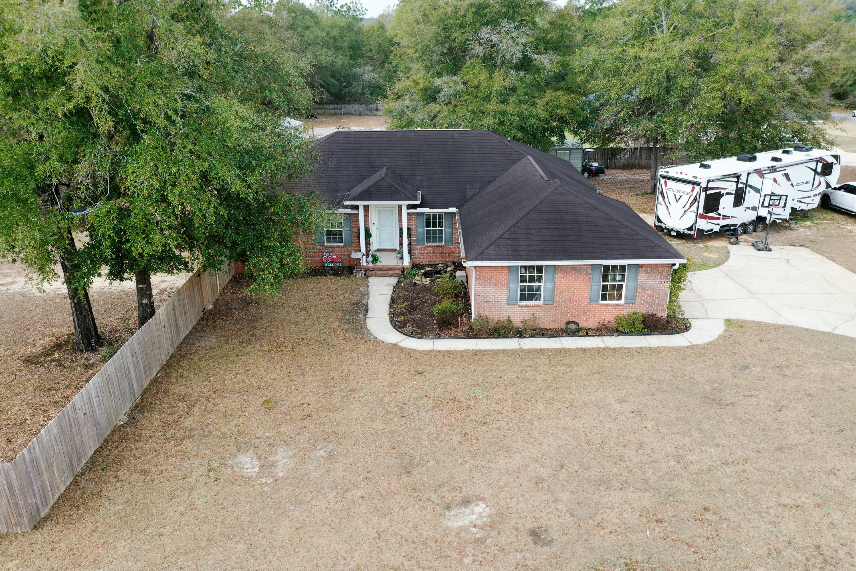 Charming Southern 4-bedroom, 2-bath home with dedicated office and a true country-living feel! Nestled on a full acre.  NEW ROOF (dimensional shingle) exotic black to be installed March 7th.  You'll absolutely love this open living/dining area concept, that flows seamlessly into the kitchen, which boasts custom white cabinets with new hardware, new granite countertops, custom tongue and groove installed on the back kitchen bar, ceramic farm sink, refrigerator 2025, and dishwasher in 2024. Premium LVP flooring was installed throughout the home in 2022, helps greatly if you have allergies.  Enjoy peaceful surroundings, comfortable living spaces and the perfect blend of charm and functionality. Never worry about power loss for any reason!  Top Brand Generac Full House generator was installe in 2023. This split floor plan provides plenty of windows, bringing in natural lightning to all the rooms.  The master suite provides a luxurious retreat, large enough for a small sitting area and you'll enjoy the new rustic accent wall. The Master Bath Suite boast dual vanities, a separate tub, separate shower and his and hers walk-in-closets.  Thoughtful details abound, laundry room with cabinets, LED lights, and the flooring is a premium 12inch LVP. Outside is your personal oasis, boasting a covered patio with a new 80inch ceiling fan, extra patio pad poured the length of the house in 2025, premium finishes, the entire back yard is privacy fenced with several gates, including a triple medal gate, powered chicken coop and an expansive covered run designed for both chickens and turkeys.  Both currently reside at this beautiful home.  The seller made sure travelers and campers are taken care of, he added a 50V AMP to provide full function for any RV. The driveway can easily hold 8 vehicles and there's plenty of room for a boat as well.  Summer is around the corner, don't worry, an above ground pool was placed into the ground for easy entrance and exit. If you like having a small garden, then you're ready to start planting with three custom raised garden beds. This home has everything and is perfect for family gatherings.  If you hurry, the seller might leave you a turkey and a few chickens.  Call today, this home won't last long!  Don't forget the new roof will be a new color with premium dimensional shingle and shutters will be painted.