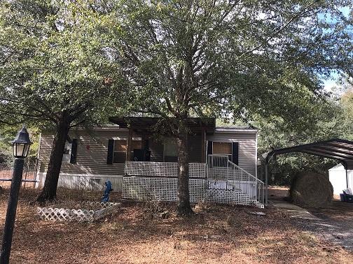 Country living with this 2008 mobile home on 1 acre, 3 bedroom 2 bath 1100 Sq Ft, open floor plan, fenced yard, carport, very quite living. Bring your horse and walk out your front door and go riding.( Pasture for horse is at a additional cost that is NOT included in monthly rent). Please note a joining property is a dog boarding center and has chicken and roosters. Home comes with 1/2 acre. So you must like country living at this property