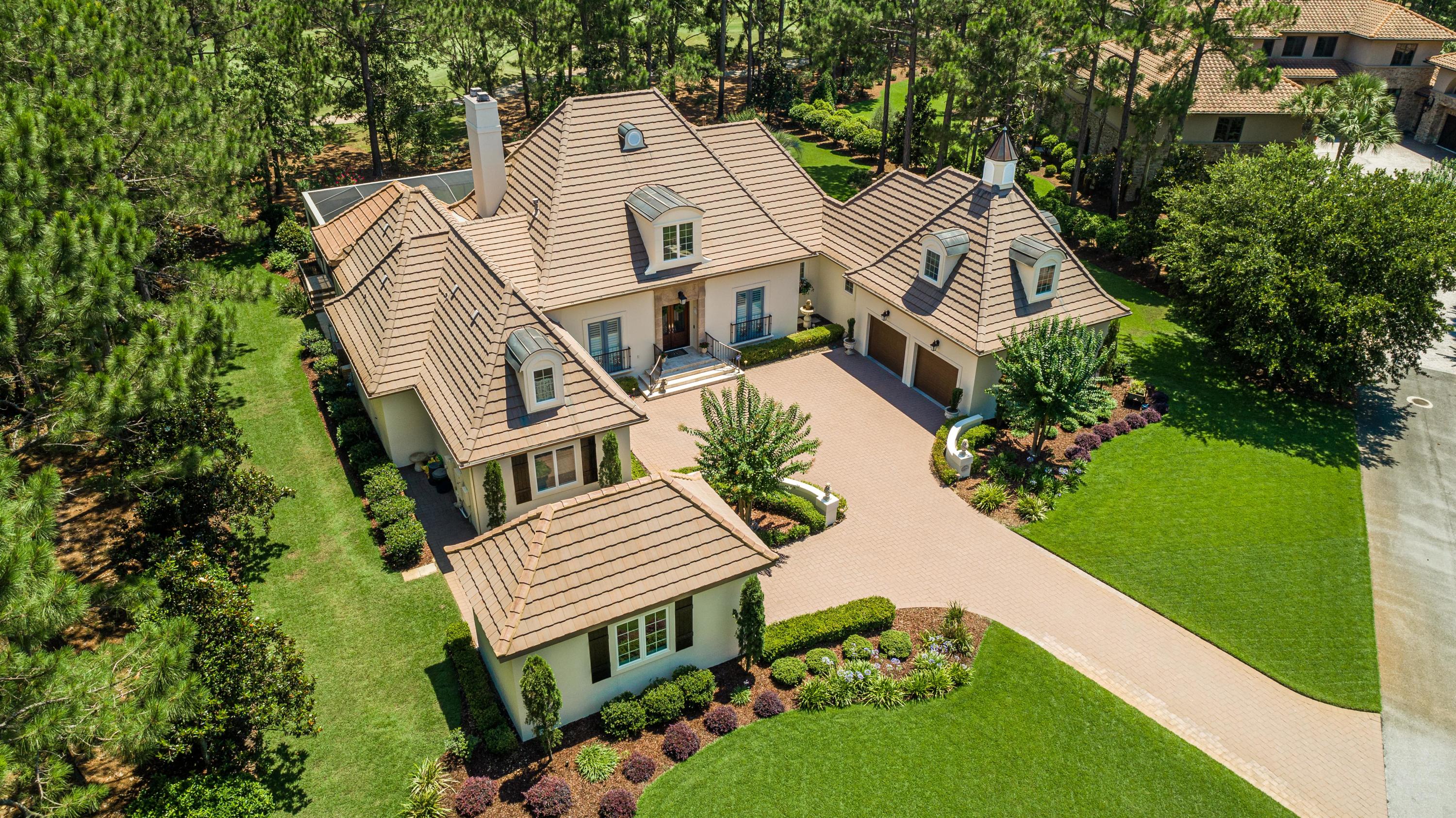 Exquisite Country French inspired home is nestled on an estate size lot in a private cul de sac in the exclusive Merion neighborhood within Burnt Pine. Enhanced to perfection with beautiful architectural details throughout. Spacious Master Suite, on the main level with Ensuite bath, sitting area, cozy fireplace,& built in cabinetry. Chefs kitchen with vaulted ceilings & exposed beams, shiplap accented walls, Thermador 6 burner range, butlers pantry, center island with built in ice maker, & coffee bar with built in refrigerated drawers. Oversized family room with custom designed fireplace mantel & warm hardwood flooring. Fabulous outdoor Enclosed Lanai with Resort style Pool & Spa, beautiful lighting & water features. Summer kitchen with Authentic Italian Pizza Oven. Remarks continued... Freshly painted exterior May of 2020 using elastomeric in a soft, elegant white palette. As an added feature, this home includes an oversized finished Bonus Room with built in window seats located above the garage with access from inside.