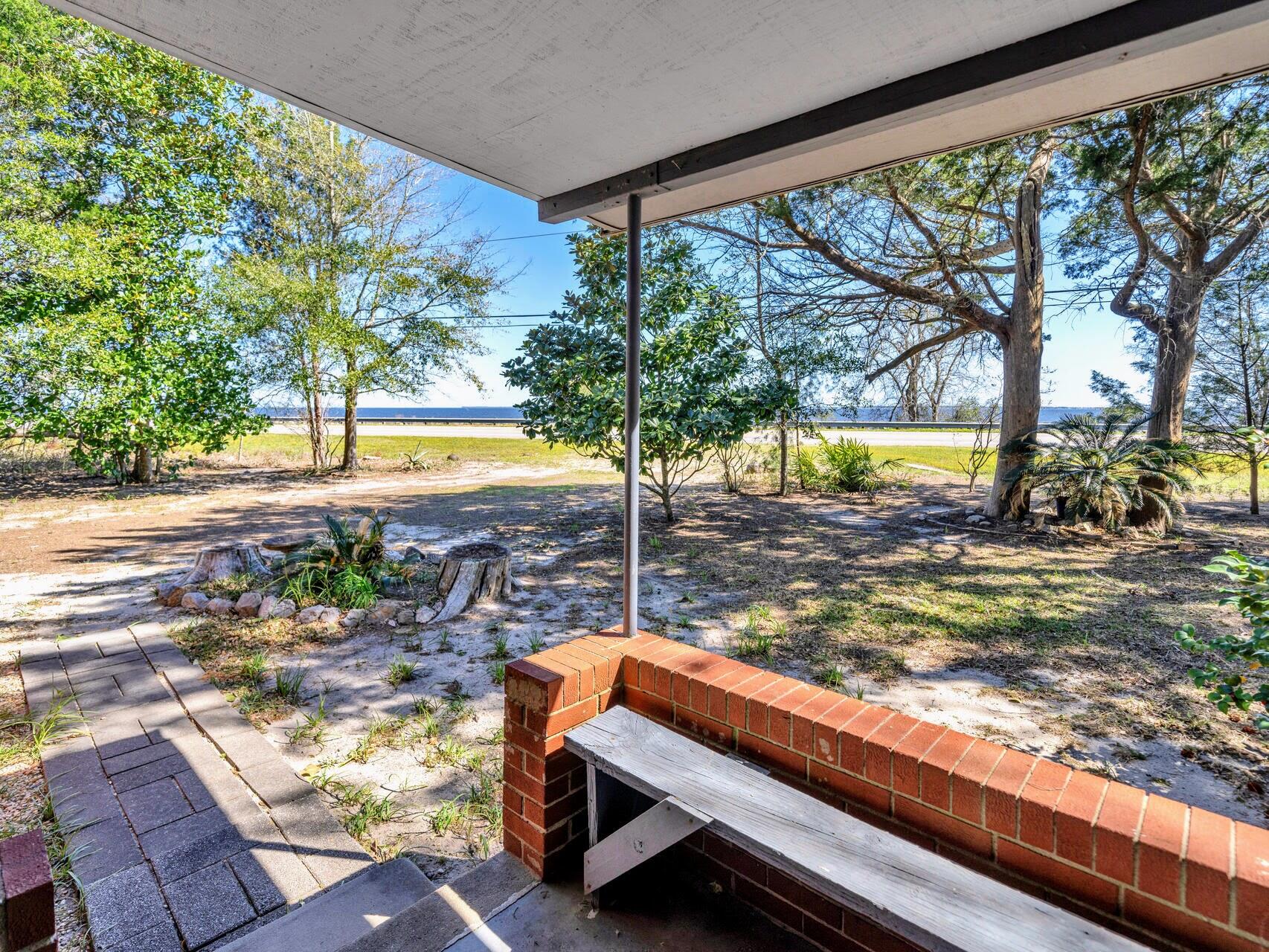 DON'T MISS THIS UNIQUE OPPORTUNITY featuring a 276' waterfront on the Choctawhatchee Bay PLUS an adjacent 1.2-acre corner lot with a cozy 3 Bedroom, two bathroom cottage.  Choctaw Beach, Florida, while enjoying a Freeport mailing address, is in Walton County with lower taxes and a peaceful lifestyle. This property offers stunning bay views, outdoor & recreational activities, and easy access to nearby beaches and amenities. Build a dock on your waterfront or, simply enjoy the view. Available for the first time in 30 years, this is your opportunity to own this high and dry property where you can enjoy nature and relax in a picturesque setting with your own waterfront access! The cottage provides a comfortable living space while you build your dream home. Features include a screened porch perfect for enjoying the outdoors! Whether you are gardening, birdwatching, fishing, or simply relaxing this is your place! The view across the Choctawhatchee Bay includes the Sandestin and Miramar Beach skyline. Enjoy a great view of fireworks from 30A to Destin during summers and holidays. Easy access to the beach, Mid Bay Bridge, Destin Commons, Niceville, Destin, Freeport, Miramar Beach, and Santa Rosa Beach, Florida makes this a highly desired property. Convenient to airports, military bases, shopping, dining, entertainment, healthcare, and services this is a most sought after area - come to see for yourself why this property is your jewel along the Choctawhatchee Bay! Private Tours Available.